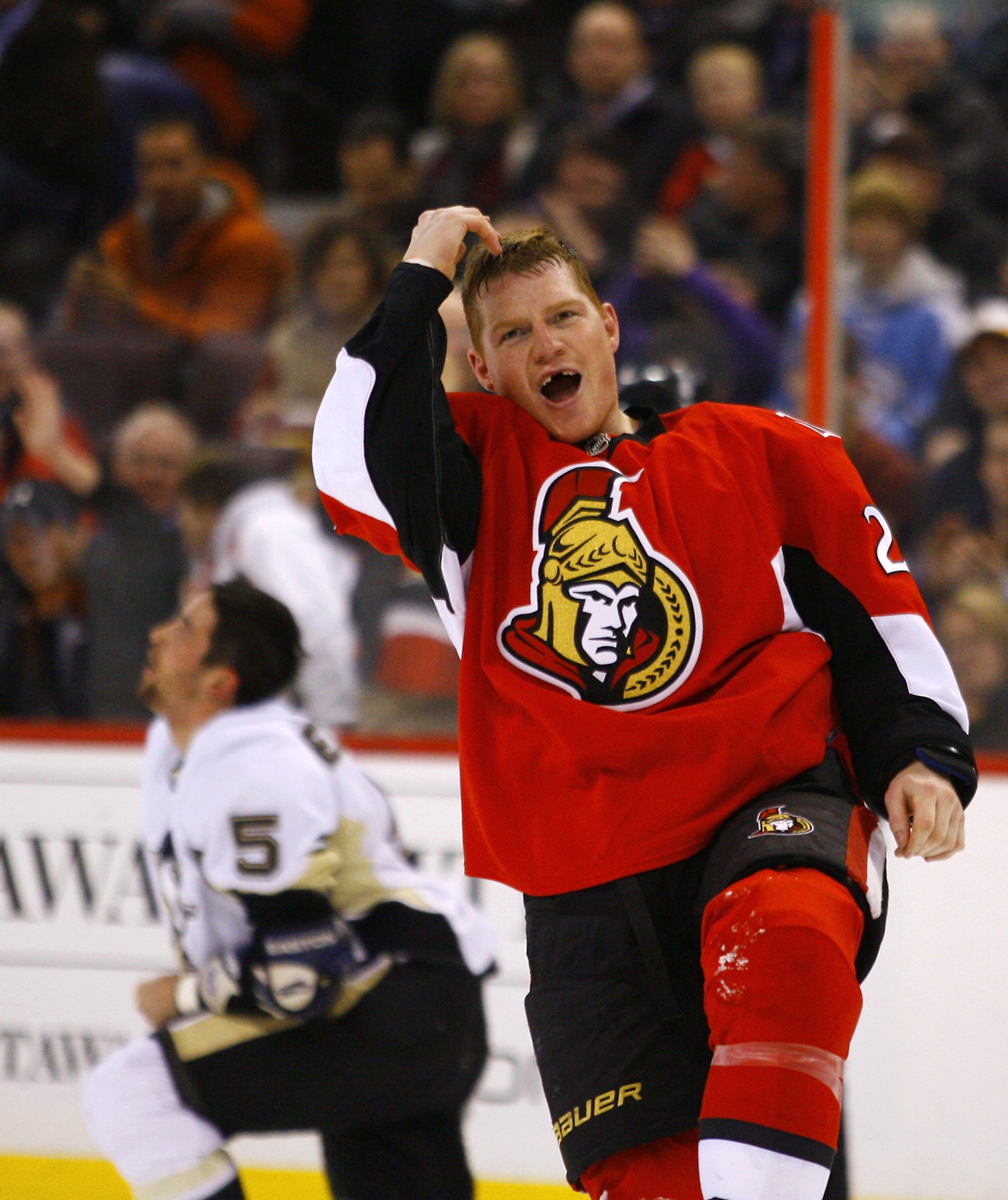 OTTAWA, CANADA - MARCH 15:  Chris Neil #25 of the Ottawa Senators gestures to the crowd after a fight with Deryk Engelland #5 of the Pittsburgh Penguins during a game at Scotiabank Place on March 15, 2011 in Ottawa, Canada.  (Photo by Phillip MacCallum/Ge