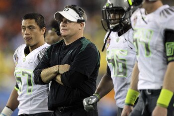 GLENDALE, AZ - JANUARY 10: Head coach Chip Kelly of the Oregon Ducks looks on against the Auburn Tigers in the Tostitos BCS National Championship Game at University of Phoenix Stadium on January 10, 2011 in Glendale, Arizona. (Photo by Ronald Martinez/G GLENDALE, AZ - JANUARY 10: Head coach Chip Kelly of the Oregon Ducks looks on against the Auburn Tigers in the Tostitos BCS National Championship Game at University of Phoenix Stadium on January 10, 2011 in Glendale, Arizona. (Photo by Ronald Martinez/G