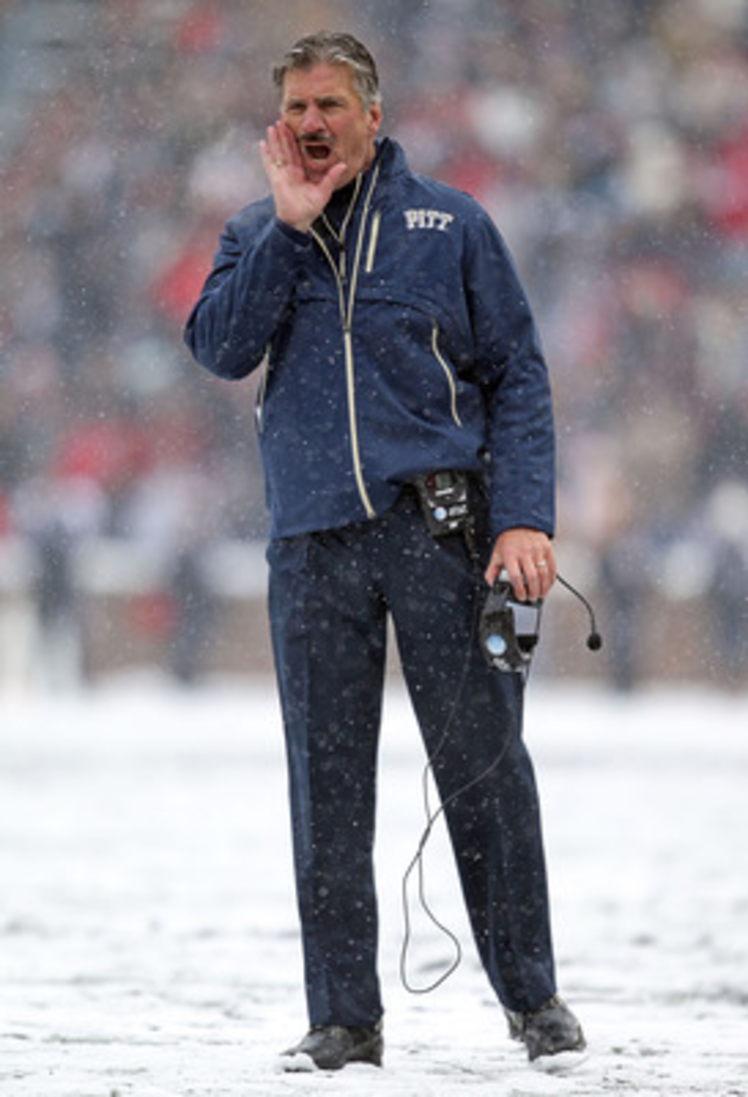 CINCINNATI, OH - DECEMBER 04:  Dave Wannstedt the Head Coach of the Pittsburgh Panthers gives instructions to his team during the Big East Conference game against the Cincinnati Bearcats at Nippert Stadium on December 4, 2010 in Cincinnati, Ohio.  (Photo