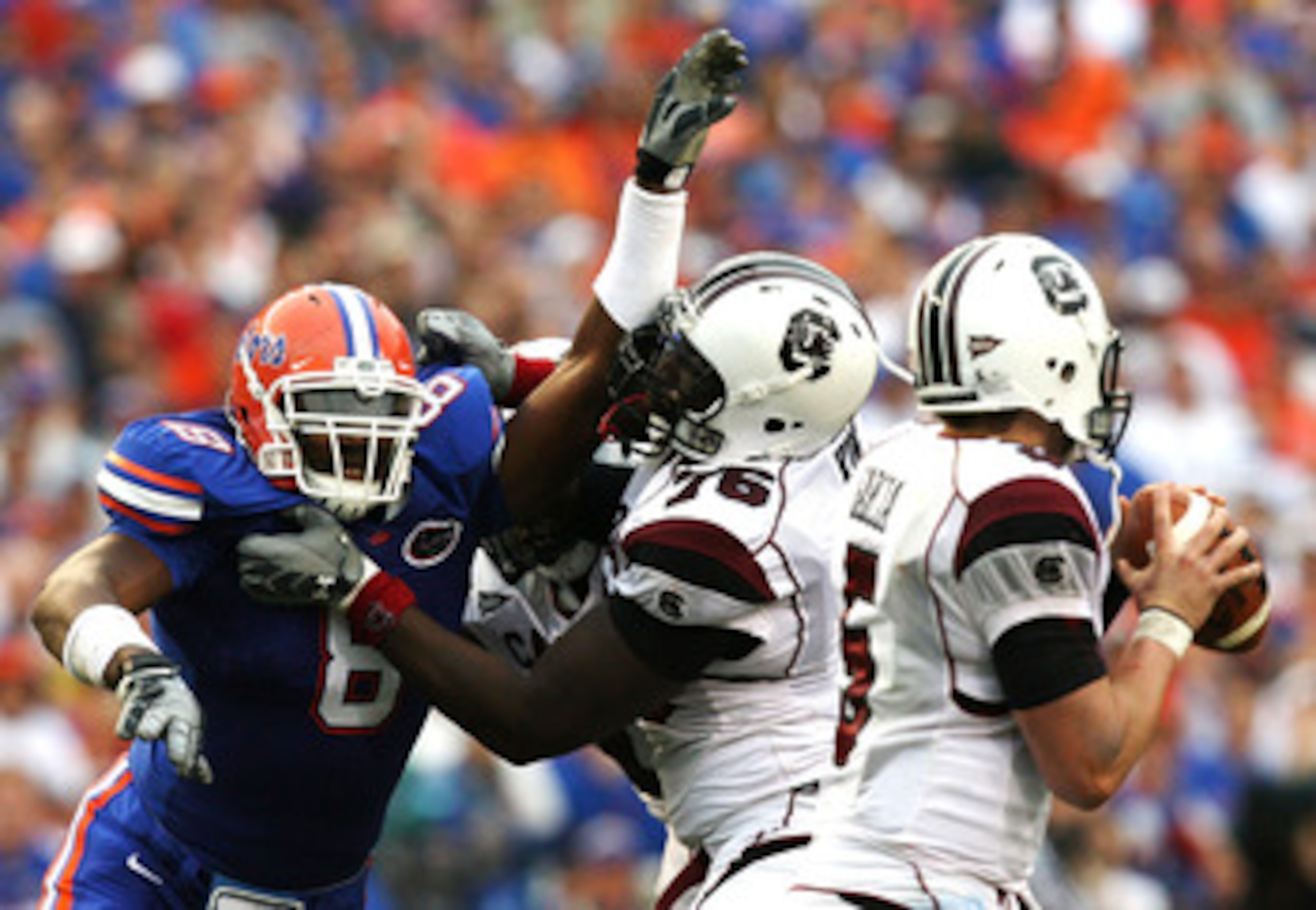 GAINESVILLE, FL - NOVEMBER 15:  Offensive lineman Jarriel King #76 the South Carolina Gamecocks tries to protect his quarterback Stephen Garcia #5 from defensive end Carlos Dunlap #8 of the Florida Gators at Ben Hill Griffin Stadium on November 15, 2008 i