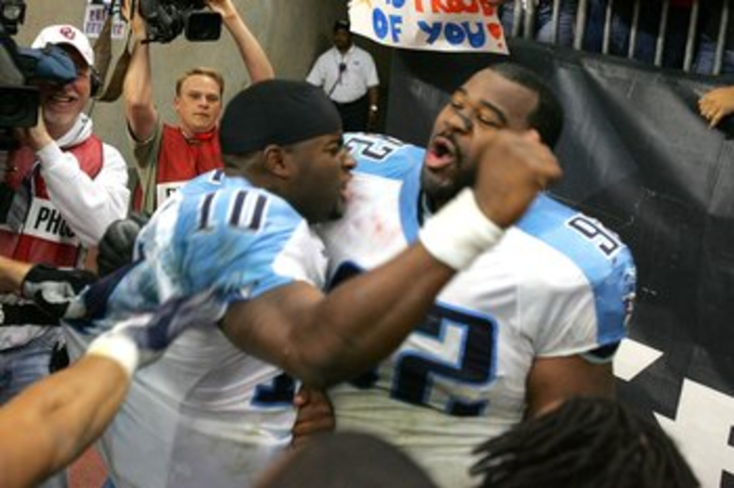 HOUSTON - DECEMBER 10:  Quarterback Vince Young #10 of the Tennessee Titans celebrates with defensive lineman Albert Haynesworth #92 after Young ran for the winning touchdown in overtime against the Houston Texans on December 10, 2006 at Reliant Stadium i