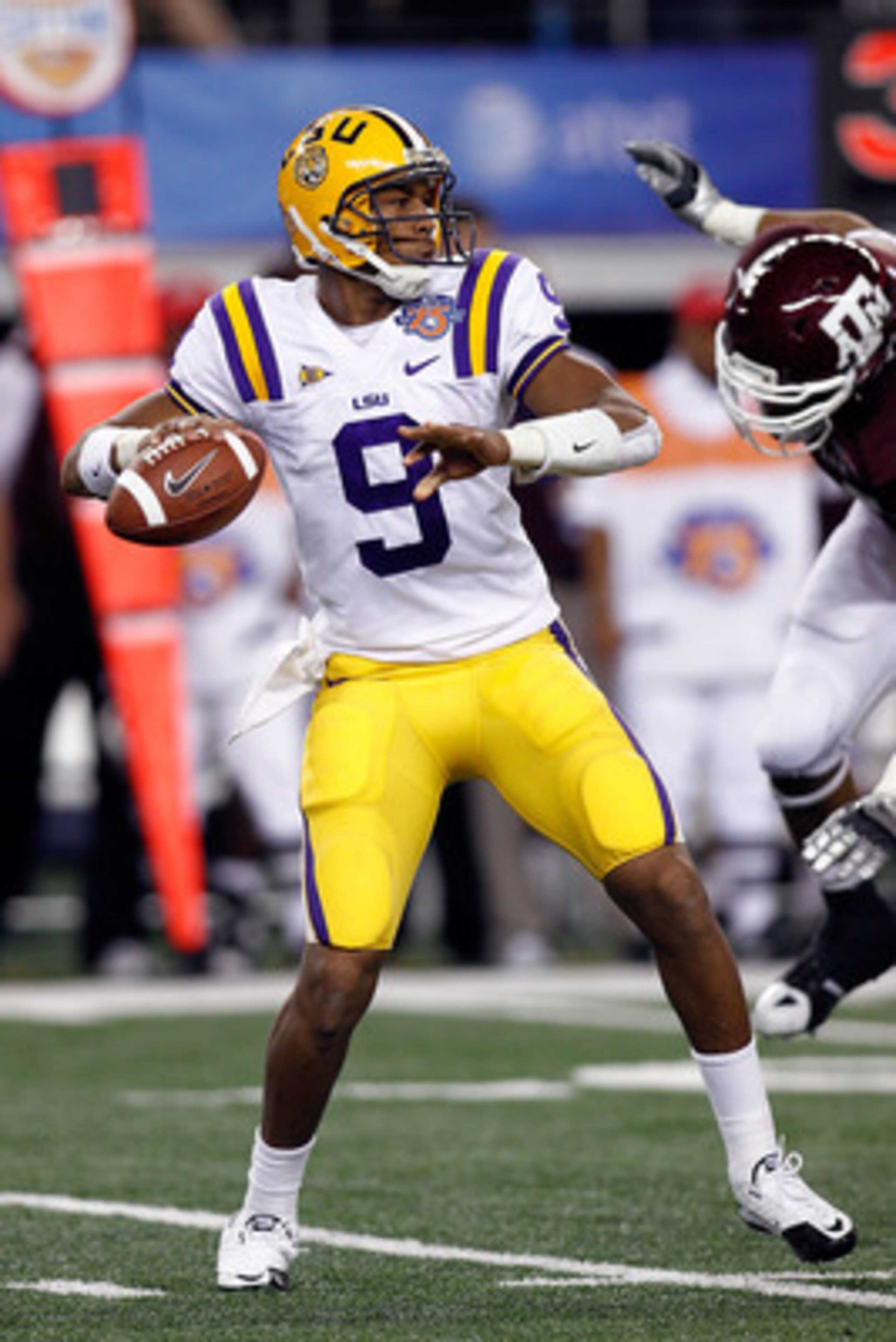 ARLINGTON, TX - JANUARY 07:  Jordan Jefferson #9 of the Louisiana State University Tigers looks to throw a pass during the game against the Texas A&M Aggies during the AT&T Cotton Bowl at Cowboys Stadium on January 7, 2011 in Arlington, Texas.  (Photo by