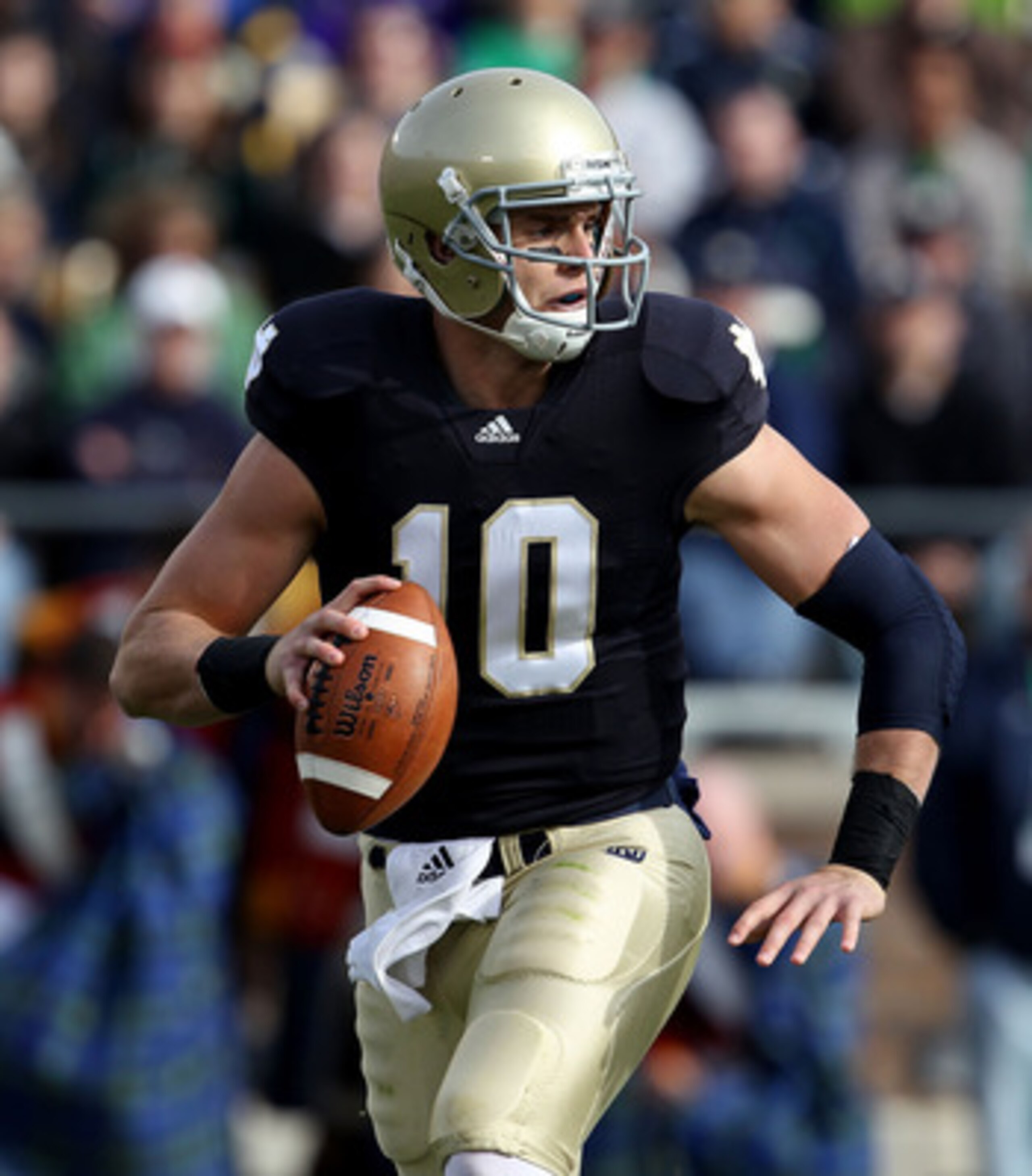 SOUTH BEND, IN - OCTOBER 30: Dayne Crist #10 of the Notre Dame Fighting Irish looks for a receiver against the Tulsa Golden Hurricane at Notre Dame Stadium on October 30, 2010 in South Bend, Indiana. Tulsa defeated Notre Dame 28-27. (Photo by Jonathan Dan