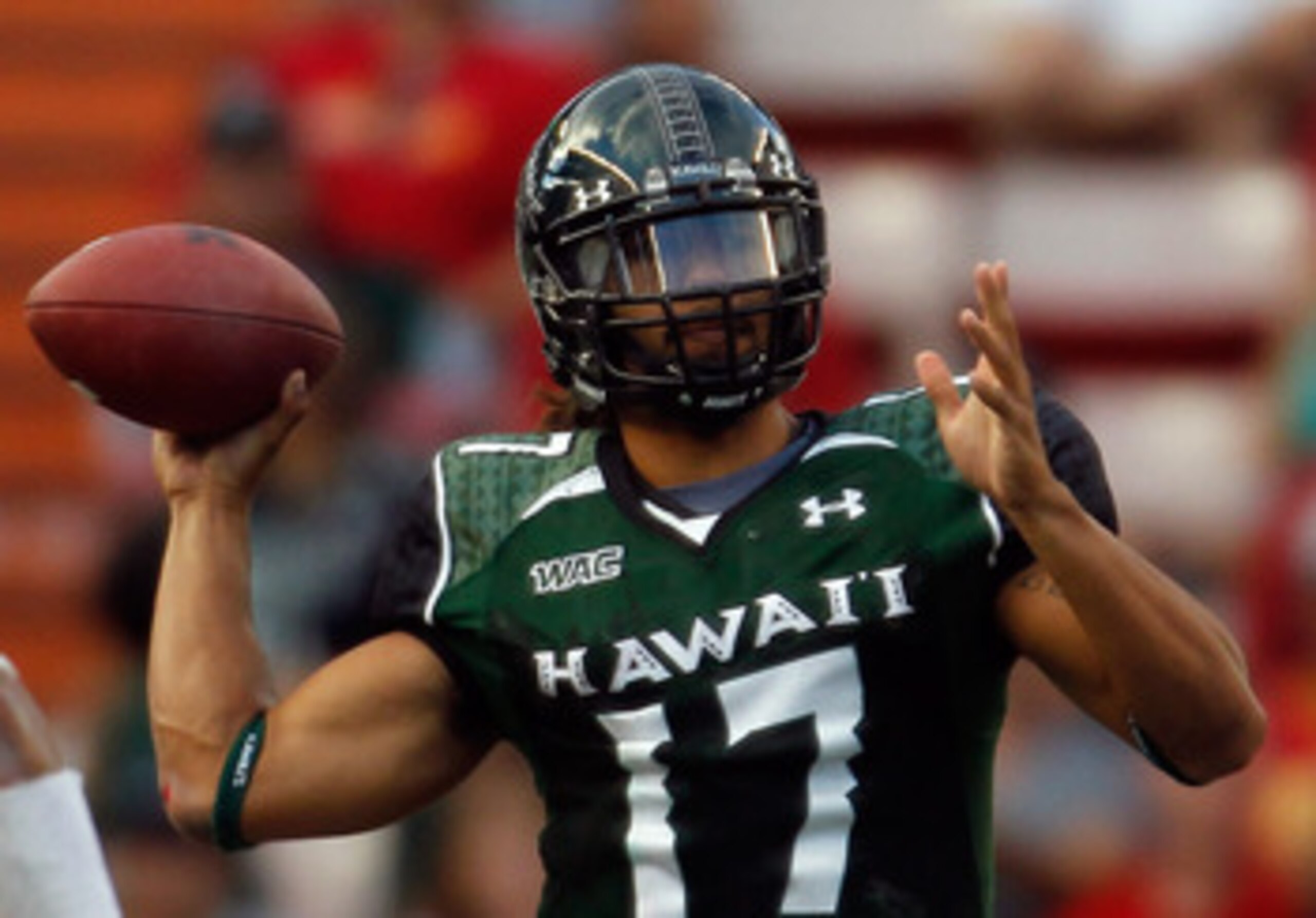 HONOLULU - SEPTEMBER 2:  Quarterback Bryant Moniz #17 of the University of Hawaii Warriors makes a pass against the University of Southern California Trojans during first half action at Aloha Stadium September 2, 2010 in Honolulu, Hawaii. (Photo by Kent N