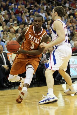 KANSAS CITY, MO - MARCH 12: Jordan Hamilton #3 of the Texas Longhorns drives with the ball against Brady Morningstar #12 of the Kansas Jayhawks during the 2011 Phillips 66 Big 12 Men's Basketball Tournament championship game at Sprint Center on March 12, KANSAS CITY, MO - MARCH 12: Jordan Hamilton #3 of the Texas Longhorns drives with the ball against Brady Morningstar #12 of the Kansas Jayhawks during the 2011 Phillips 66 Big 12 Men's Basketball Tournament championship game at Sprint Center on March 12,