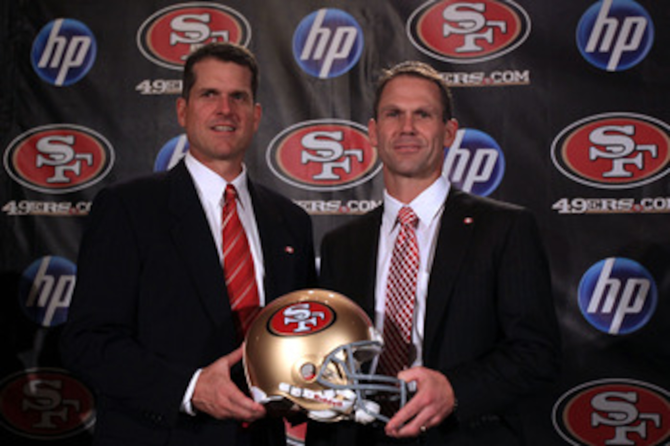 SAN FRANCISCO, CA - JANUARY 07:  Jim Harbaugh and general manager Trent Baalke pose for a picture following a press conference where Harbaugh was introduced as the new San Francisco 49ers head coach at the Palace Hotel on January 7, 2011 in San Francisco,