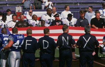 23 Sep 2001:  An American Flag is held in memory of 9/11 as the National Anthem is sung during opening cerimonies before the game between the Philadelphia Eagles and the Seattle Seahawks at the Husky Stadium in Seattle, Washington. The Eagles defeated the