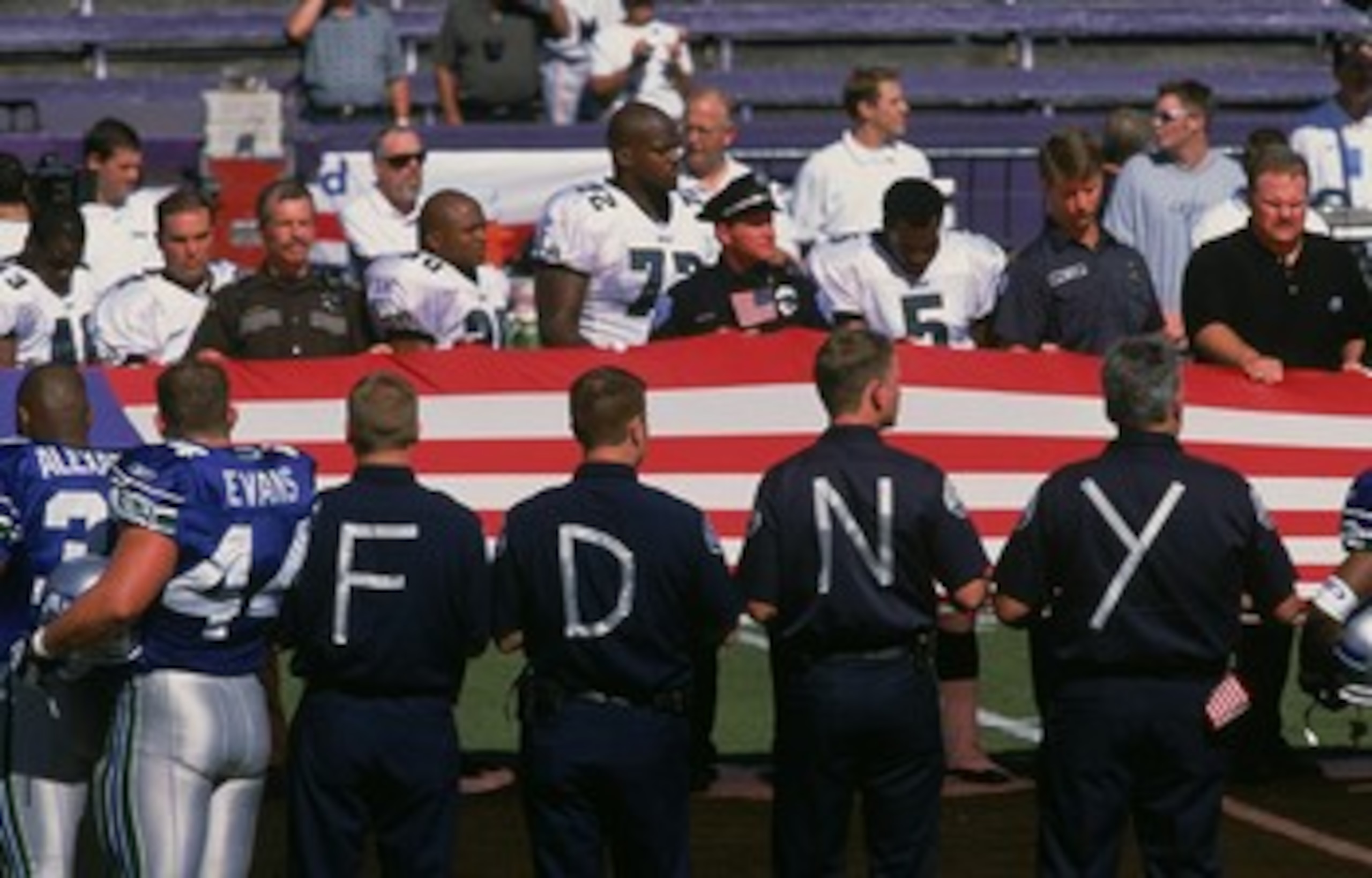 23 Sep 2001: An American Flag is held in memory of 9/11 as the National Anthem is sung during opening cerimonies before the game between the Philadelphia Eagles and the Seattle Seahawks at the Husky Stadium in Seattle, Washington. The Eagles defeated the 23 Sep 2001: An American Flag is held in memory of 9/11 as the National Anthem is sung during opening cerimonies before the game between the Philadelphia Eagles and the Seattle Seahawks at the Husky Stadium in Seattle, Washington. The Eagles defeated the