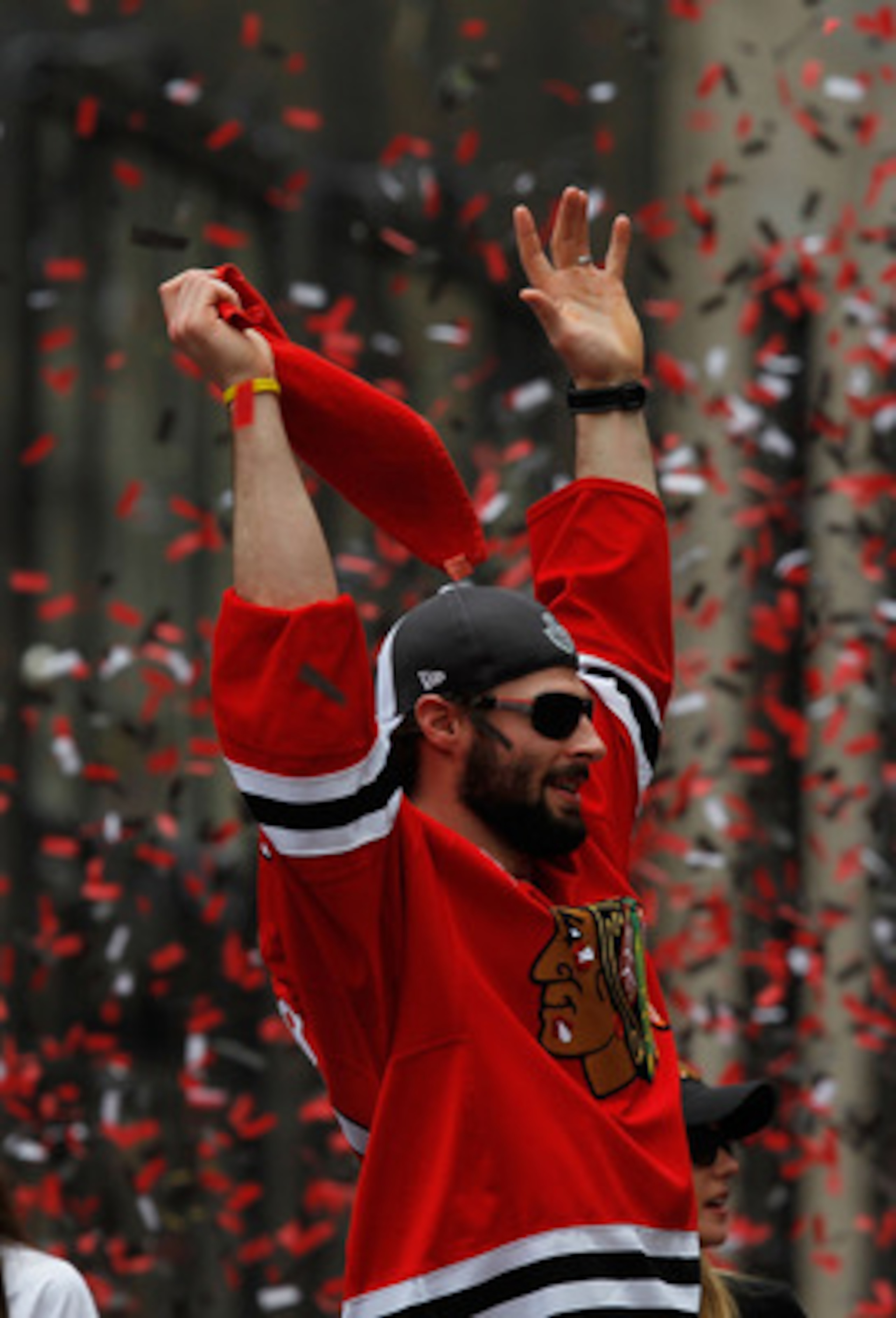 CHICAGO - JUNE 11: Troy Brouwer #22 waves to the corwd during the Chicago Blackhawks Stanley Cup victory parade and rally on June 11, 2010 in Chicago, Illinois. (Photo by Jonathan Daniel/Getty Images)