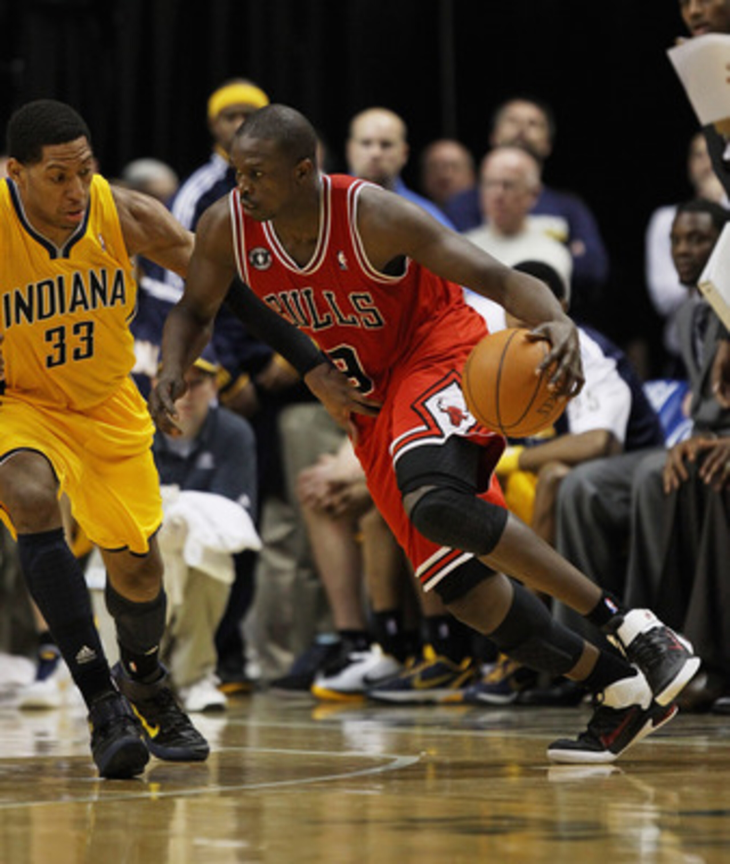 INDIANAPOLIS, IN - APRIL 23: Loul Deng #9 of the Chicago Bulls drives against Danny Granger #33 of the Indiana Pacers in Game Four of the Eastern Conference Quarterfinals in the 2011 NBA Playoffs at Conseco Fieldhouse on April 23, 2011 in Indianapolis, In