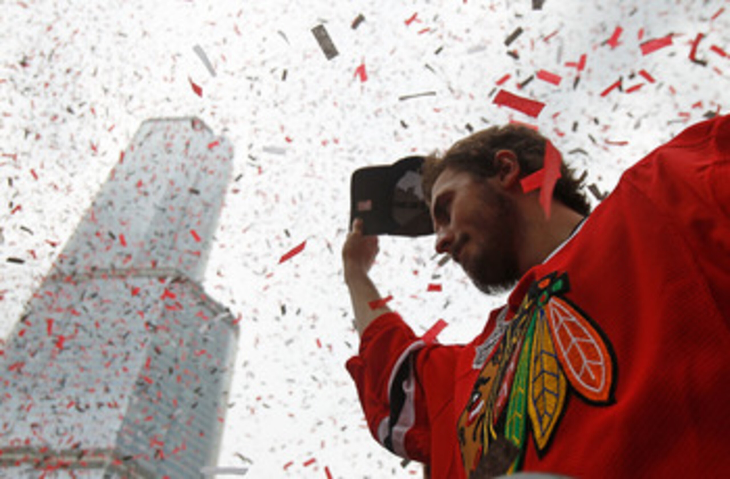 CHICAGO - JUNE 11: Dave Bolland #36 waves to the crowd during the Chicago Blackhawks Stanley Cup victory parade and rally on June 11, 2010 in Chicago, Illinois. (Photo by Jonathan Daniel/Getty Images)