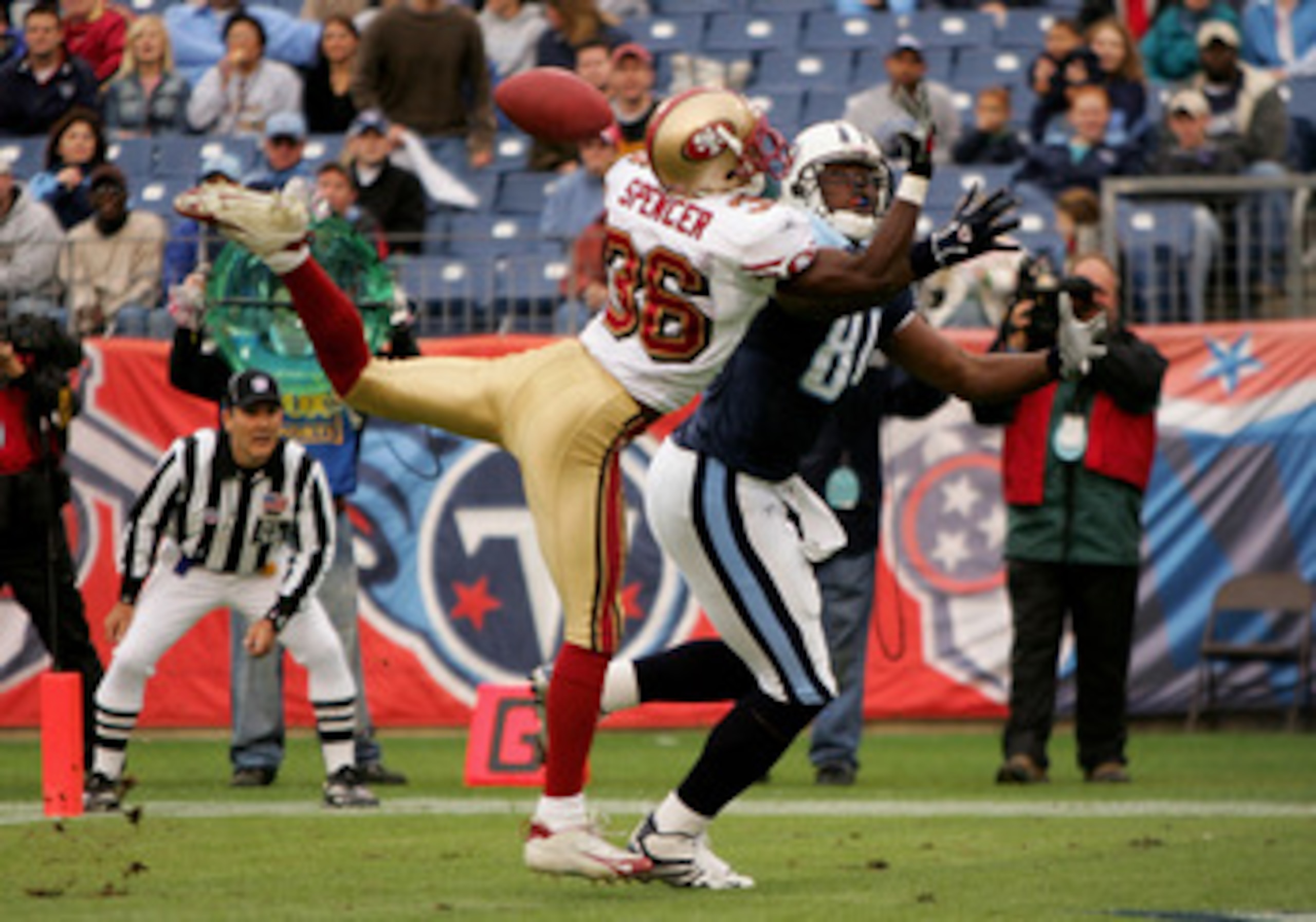NASHVILLE, TN - NOVEMBER 27: Shawntee Spencer #36 of the San Francisco 49ers breaks up a pass in the end zone intended for Erron Kinney #88 of the Tennessee Titans during week 12 NFL action on November 27, 2005 at the Coliseum in Nashville, Tennessee.  (P