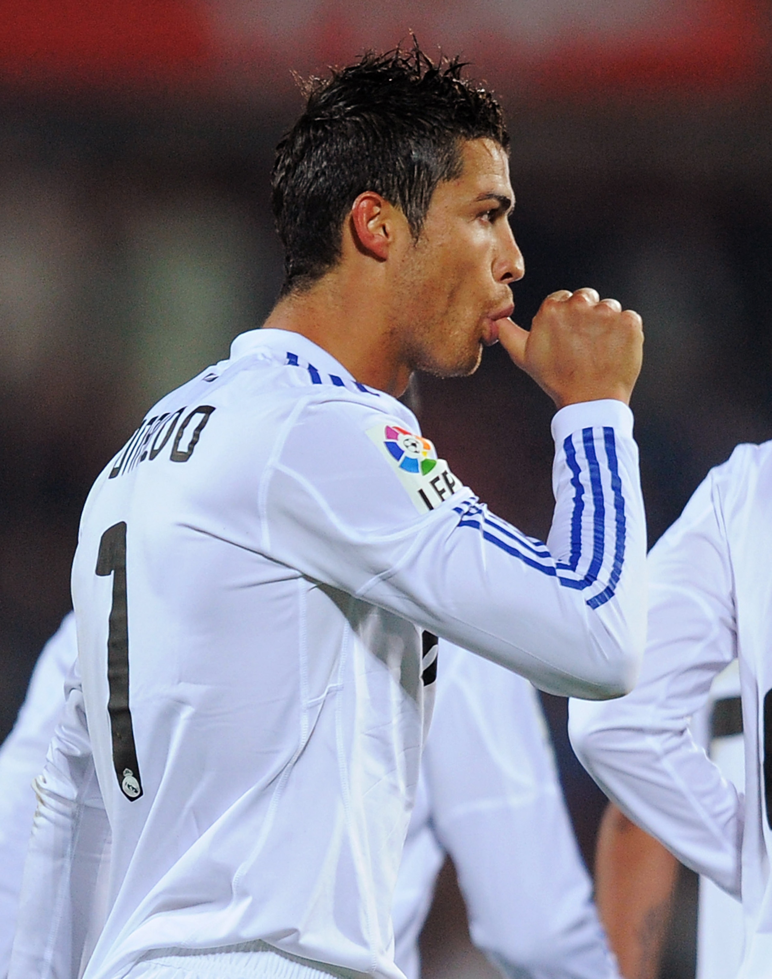 GETAFE, SPAIN - JANUARY 03:  Cristiano Ronaldo of Real Madrid celebrates after scoring Real's first goal from the penalty spot during the La Liga match between Getafe and Real Madrid at Coliseum Alfonso Perez stadium on January 3, 2011 in Getafe, Spain.