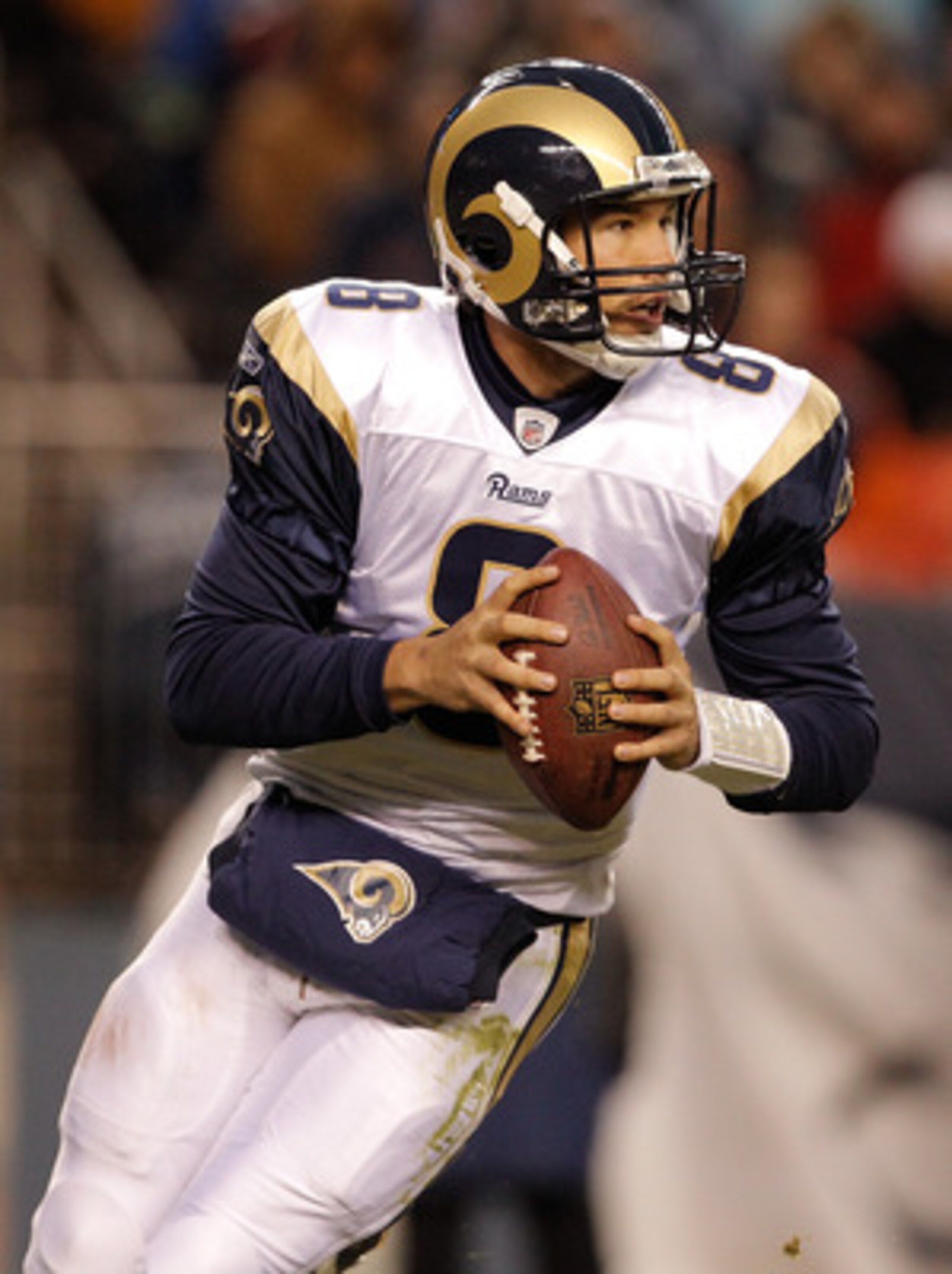 DENVER - NOVEMBER 28: Quarterback Sam Bradford #8 of the St. Louis Rams rolls out of the pocket during the third quarter against the Denver Broncos at INVESCO Field at Mile High on November 28, 2010 in Denver, Colorado. The Rams defeated the Broncos 36-3 DENVER - NOVEMBER 28: Quarterback Sam Bradford #8 of the St. Louis Rams rolls out of the pocket during the third quarter against the Denver Broncos at INVESCO Field at Mile High on November 28, 2010 in Denver, Colorado. The Rams defeated the Broncos 36-3