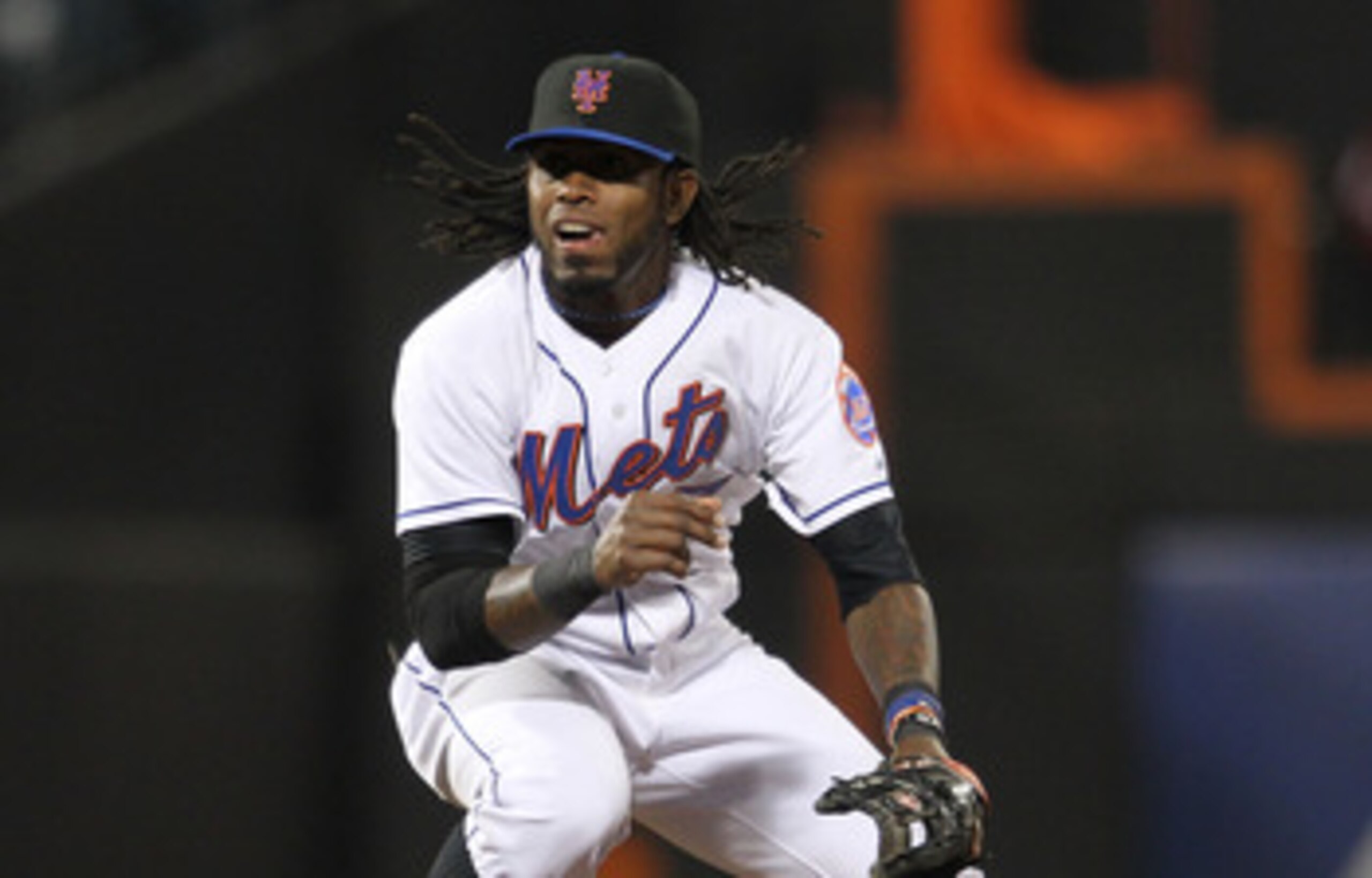 NEW YORK, NY - APRIL 21: Jose Reyes #7 of the New York Mets turns a double play over the slide of Matt Downs #16 of the Houston Astros at Citi Field on April 21, 2011 in the Flushing neighborhood of the Queens borough of New York City.  (Photo by Nick Lah