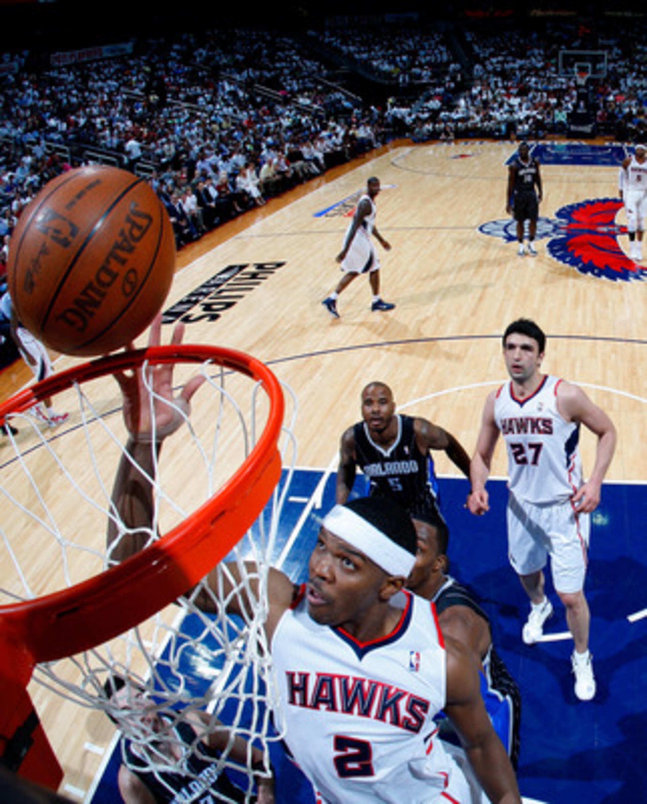 ATLANTA, GA - APRIL 28:  Joe Johnson #2 of the Atlanta Hawks tips in a basket against the Orlando Magic during Game Six of the Eastern Conference Quarterfinals in the 2011 NBA Playoffs at Philips Arena on April 28, 2011 in Atlanta, Georgia.  NOTE TO USER: