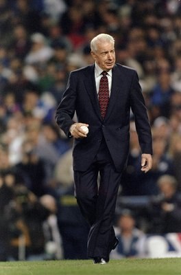 20 Oct 1996:  Baseball great Joe Dimaggio walks out to the pitchers mound to throw out the first pitch of the 1996 World Series Game One between the Atlanta Braves and the New York Yankees at Yankee Stadium in the Bronx, New York. The Braves defeated the