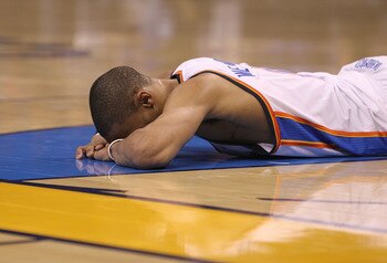 OKLAHOMA CITY, OK - MAY 01:  Guard Russell Westbrook #0 of the Oklahoma City Thunder falls on the court after a foul during a 114-101 loss against the Memphis Grizzlies in Game One of the Western Conference Semifinals in the 2011 NBA Playoffs on May 1, 20