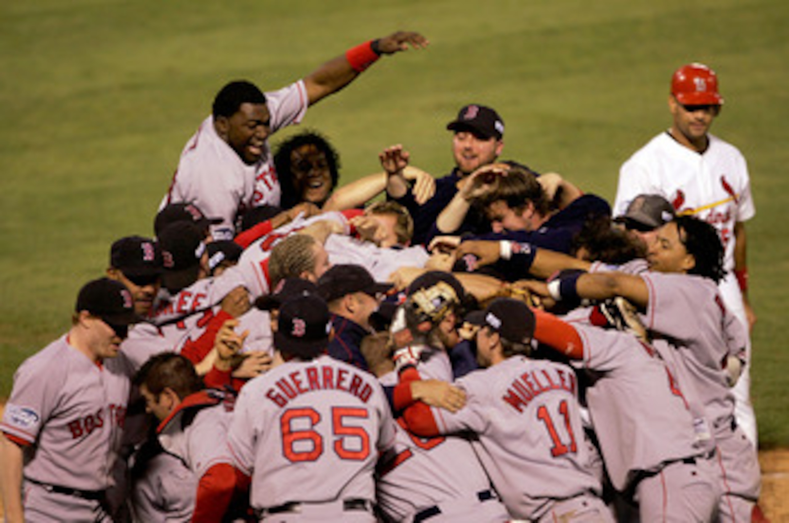 ST LOUIS - OCTOBER 27:  The Boston Red Sox celebrate after defeating the St. Louis Cardinals 3-0 to win game four of the World Series on October 27, 2004 at Busch Stadium in St. Louis, Missouri.  (Photo by Stephen Dunn/Getty Images)