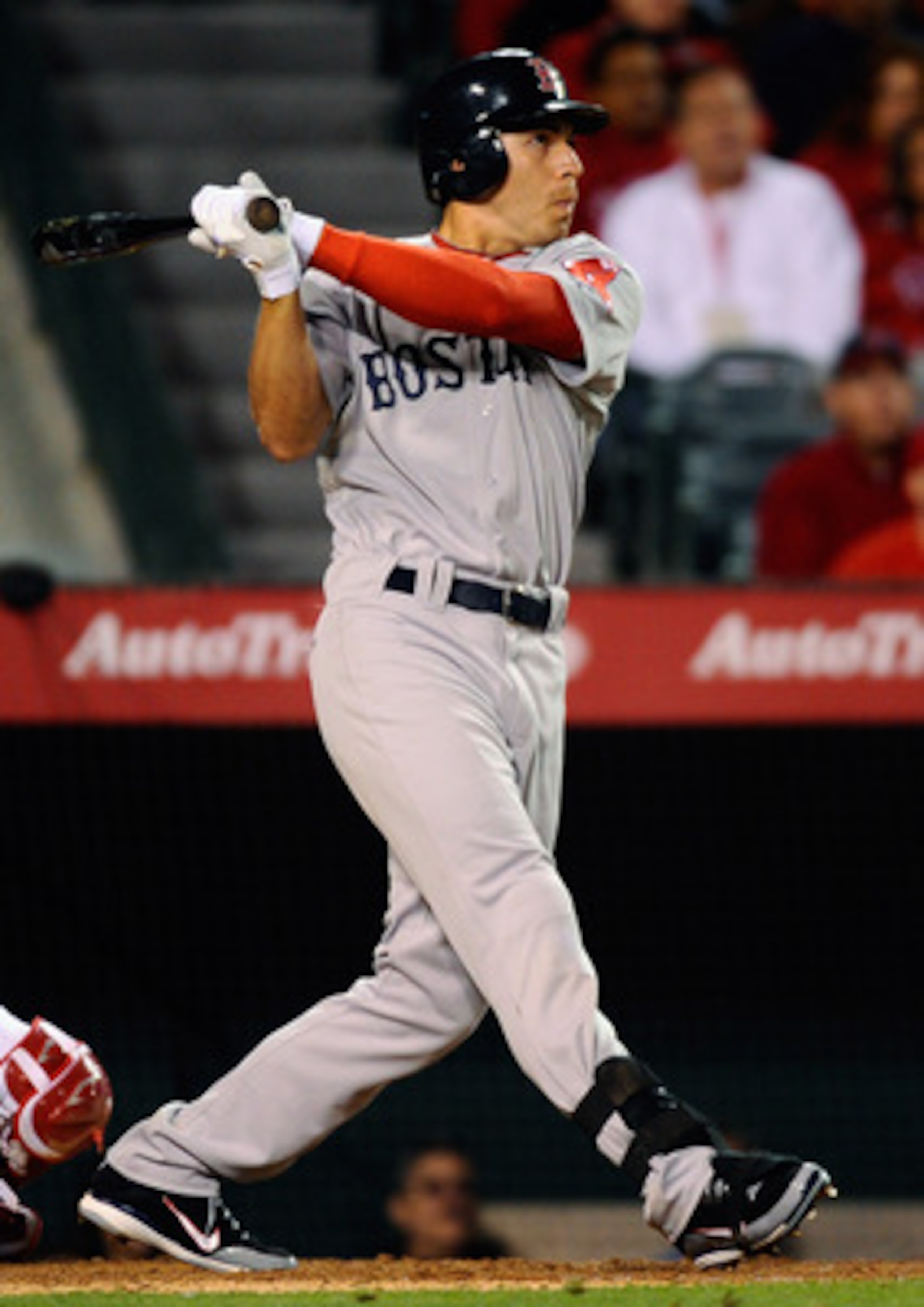 ANAHEIM, CA - APRIL 21:  Jacoby Ellsbury #2 of the Boston Red Sox hits a two run single against the Los Angeles Angels of Anaheim to score teammates David Ortiz #34 and Jed Lowrie # 12 during the sixth inning of the baseball game at Angel Stadium of Anahe