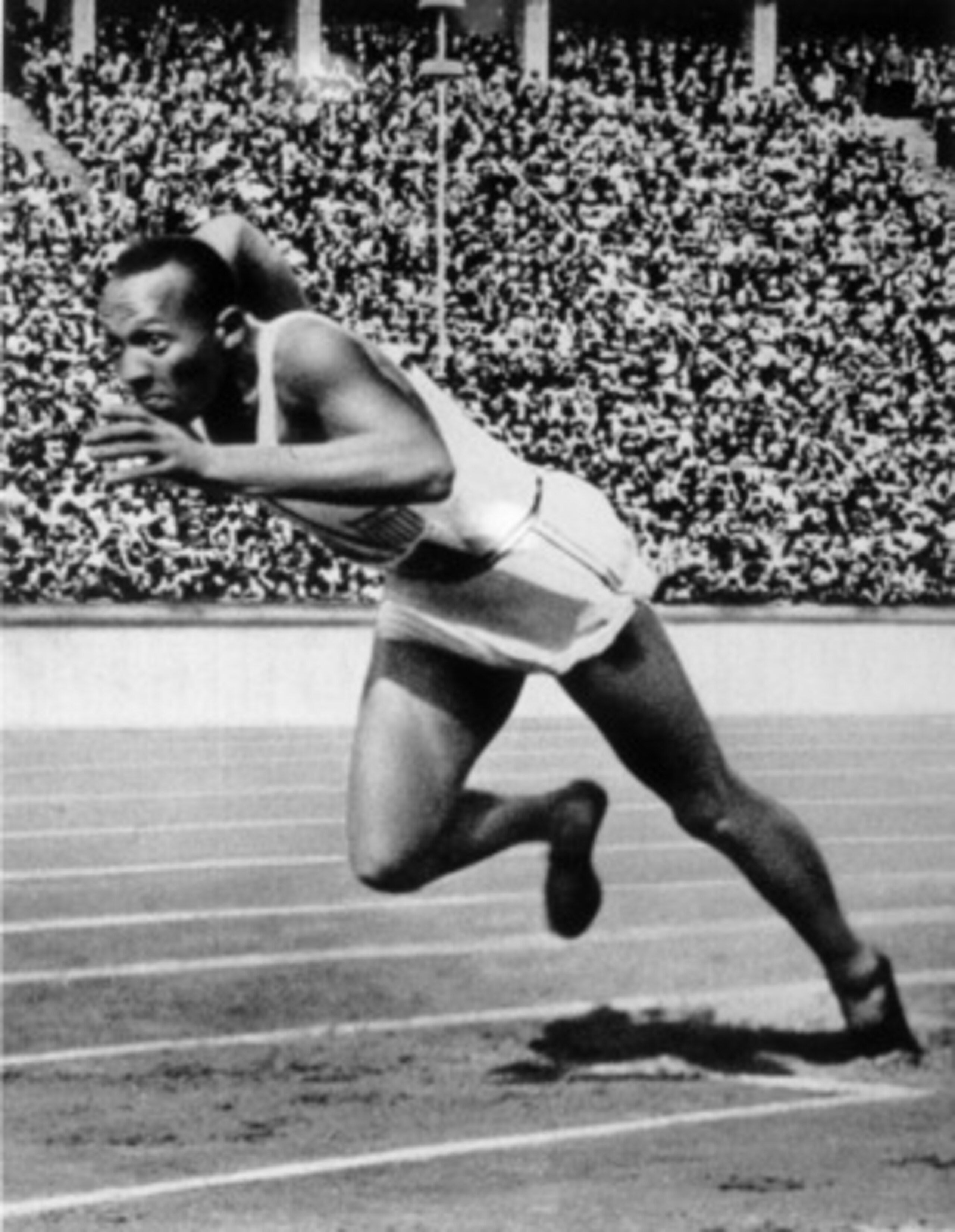 BERLIN - 1936 : Jesse Owens of the USA in action in the mens 200m at the 1936 Summer Olympic Games held in Berlin, Germany. Owens won a total of four gold medals in the Olympics, winning the mens 100m final, 200m final and the long jump competiton as we BERLIN - 1936 : Jesse Owens of the USA in action in the mens 200m at the 1936 Summer Olympic Games held in Berlin, Germany. Owens won a total of four gold medals in the Olympics, winning the mens 100m final, 200m final and the long jump competiton as we
