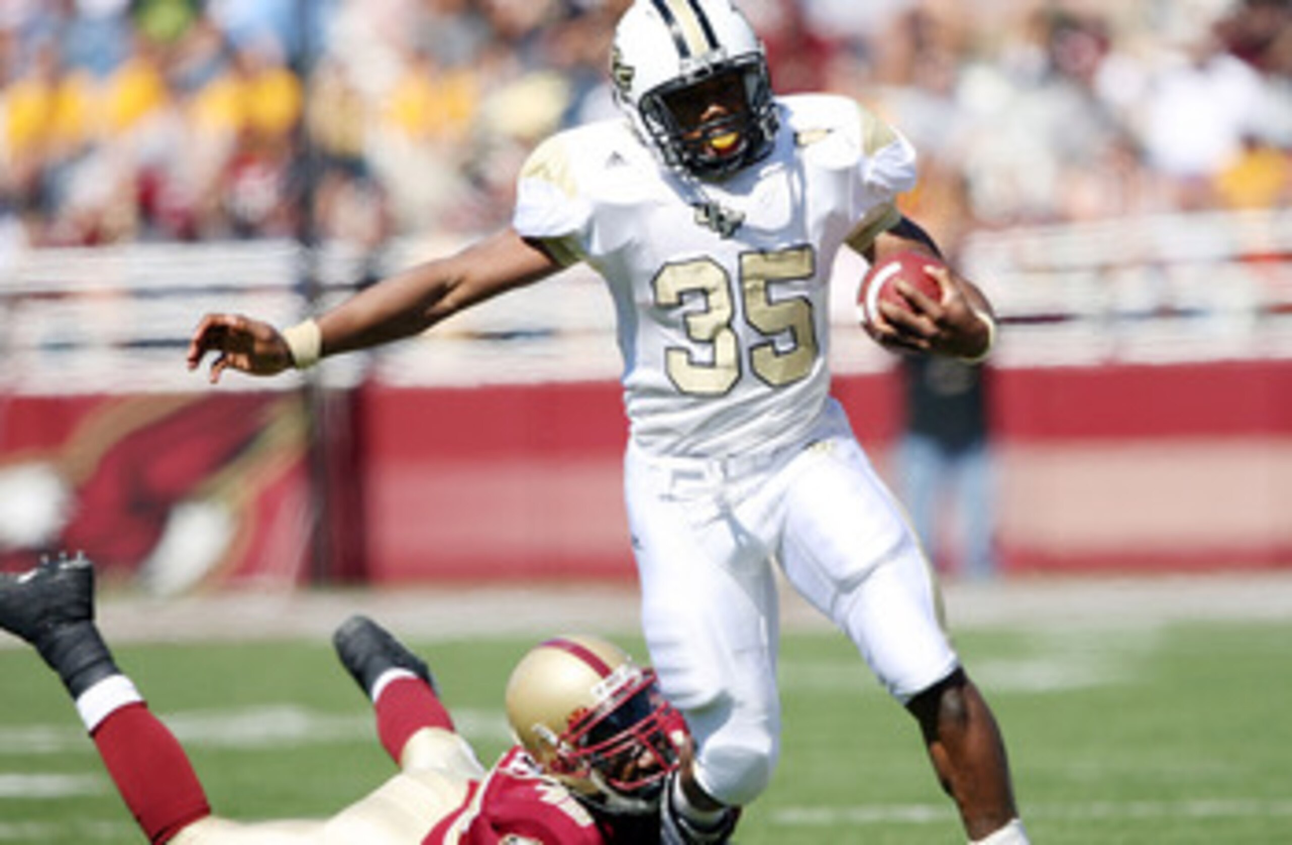 CHESTNUT HILL, MA - SEPTEMBER 20:  Ronnie Weaver #35 of the Central Florida Knights carries the ball as Wes Davis #45 of the Boston College Eagles tries to tackle on September 20, 2008 at Alumni Stadium in Chestnut Hill, Massachusetts.  (Photo by Elsa/Get