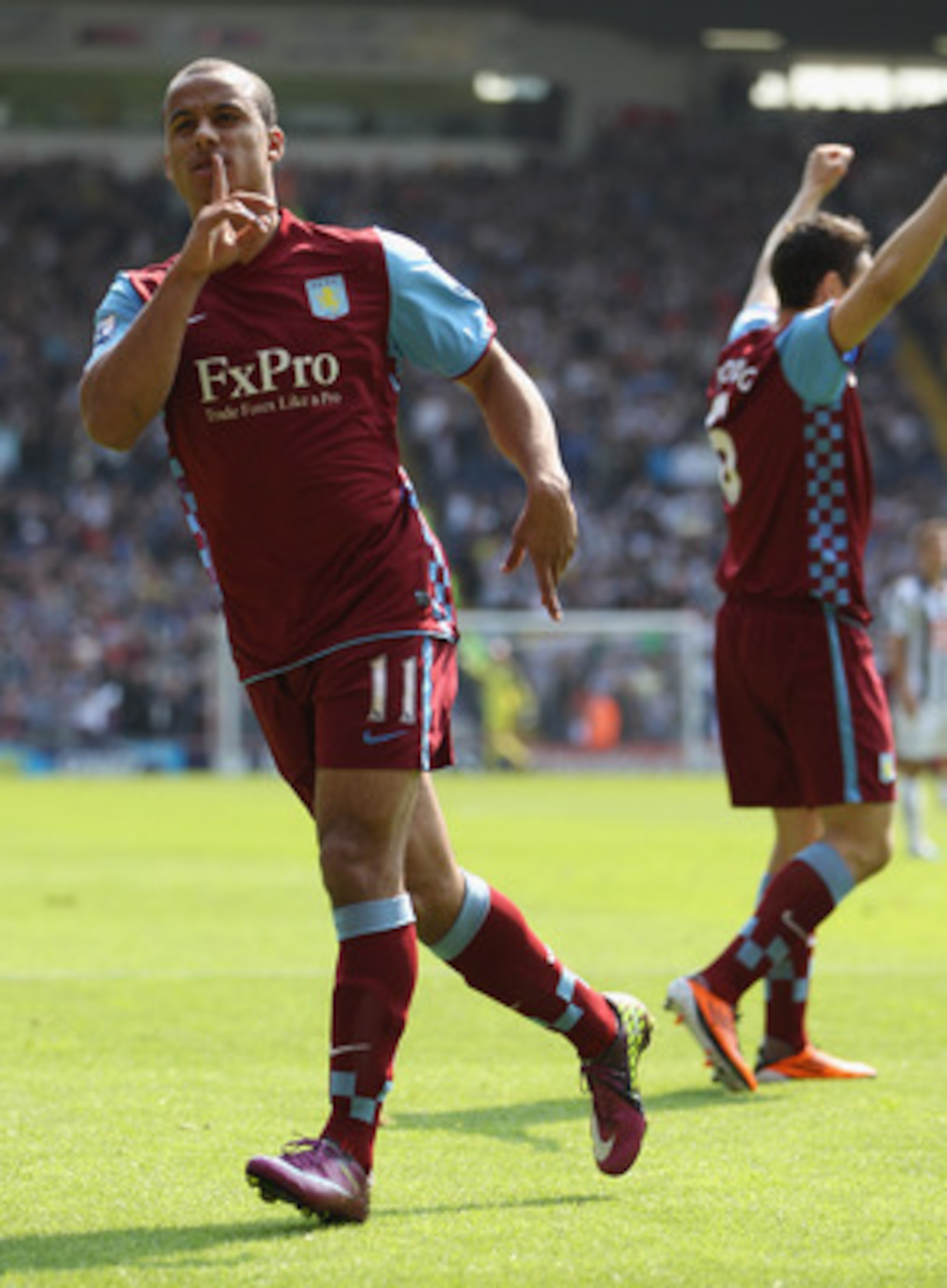 WEST BROMWICH, ENGLAND - APRIL 30:  Gabriel Agbonlahor (L) of Aston Villa celebrates in front of the home fans after an own goal scored by Abdoulaye Meite puts Villa in the lead during the Barclays Premier League match between West Bromwich Albion and Ast