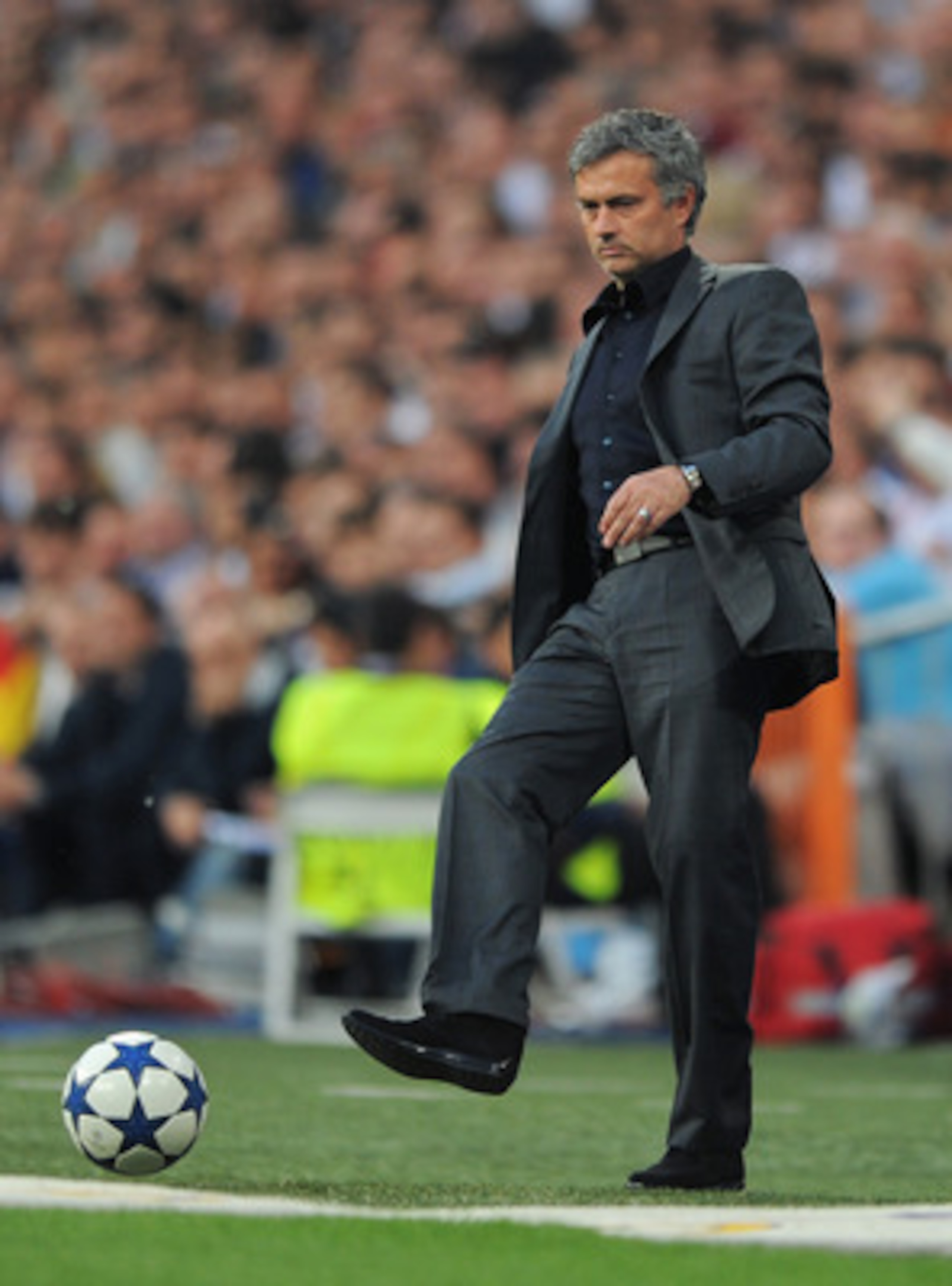 MADRID, SPAIN - APRIL 27: Head coach Jose Mourinho of Real Madrid strikes the ball during the UEFA Champions League Semi Final first leg match between Real Madrid and Barcelona at the Estadio Santiago Bernabeu on April 27, 2011 in Madrid, Spain. (Photo MADRID, SPAIN - APRIL 27: Head coach Jose Mourinho of Real Madrid strikes the ball during the UEFA Champions League Semi Final first leg match between Real Madrid and Barcelona at the Estadio Santiago Bernabeu on April 27, 2011 in Madrid, Spain. (Photo