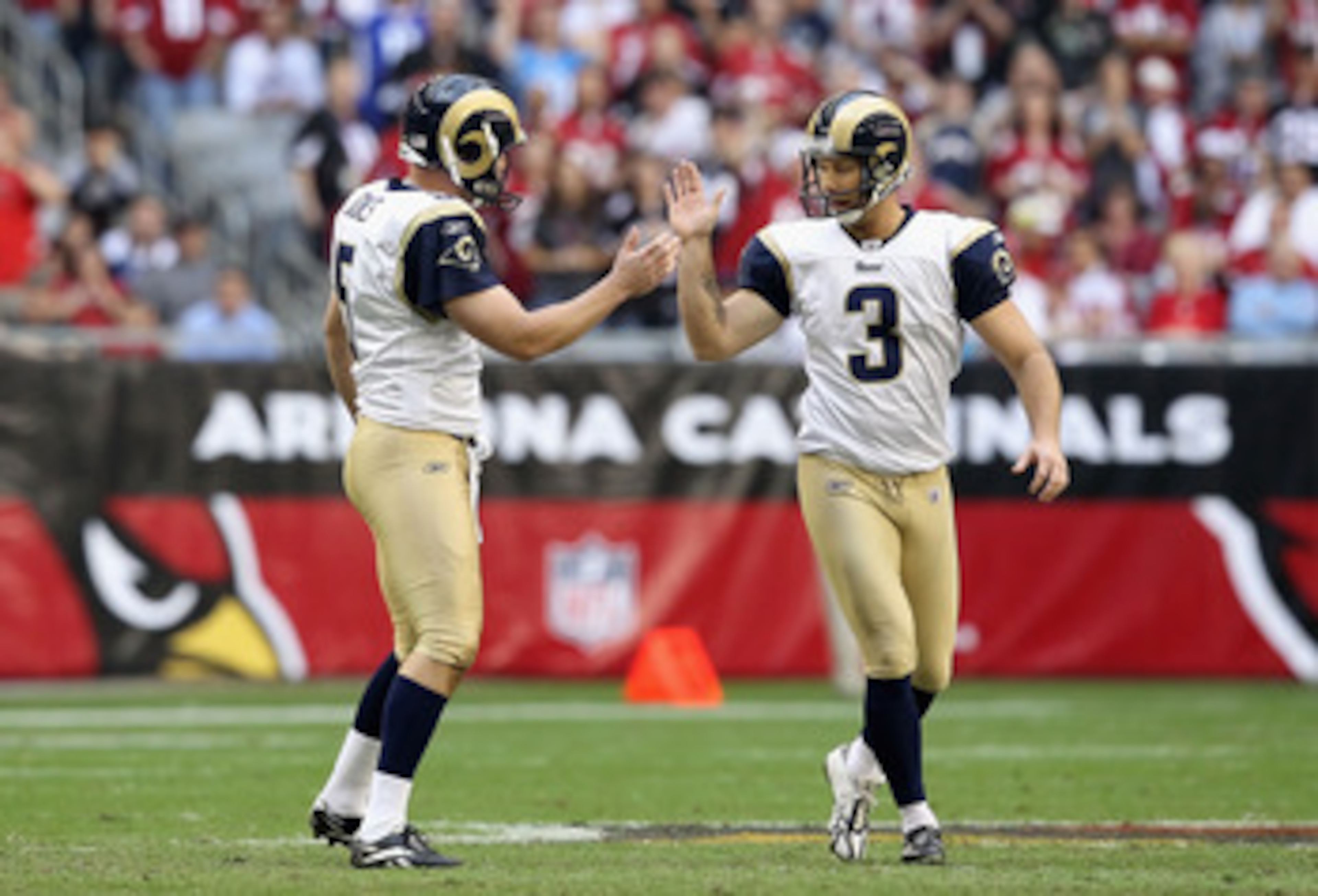 GLENDALE, AZ - DECEMBER 05:  Kicker Josh Brown #3 of the St. Louis Rams high fives teammate Donnie Jones #5 after Brown kicked a 52 yard field goal against the Arizona Cardinals during the second quarter of the NFL game at the University of Phoenix Stadiu