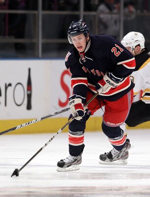 NEW YORK, NY - APRIL 04: Derek Stepan #21 of the New York Rangers skates against the Boston Bruins at Madison Square Garden on April 4, 2011 in New York City. The Rangers defeated the Bruins 5-3.  (Photo by Bruce Bennett/Getty Images)