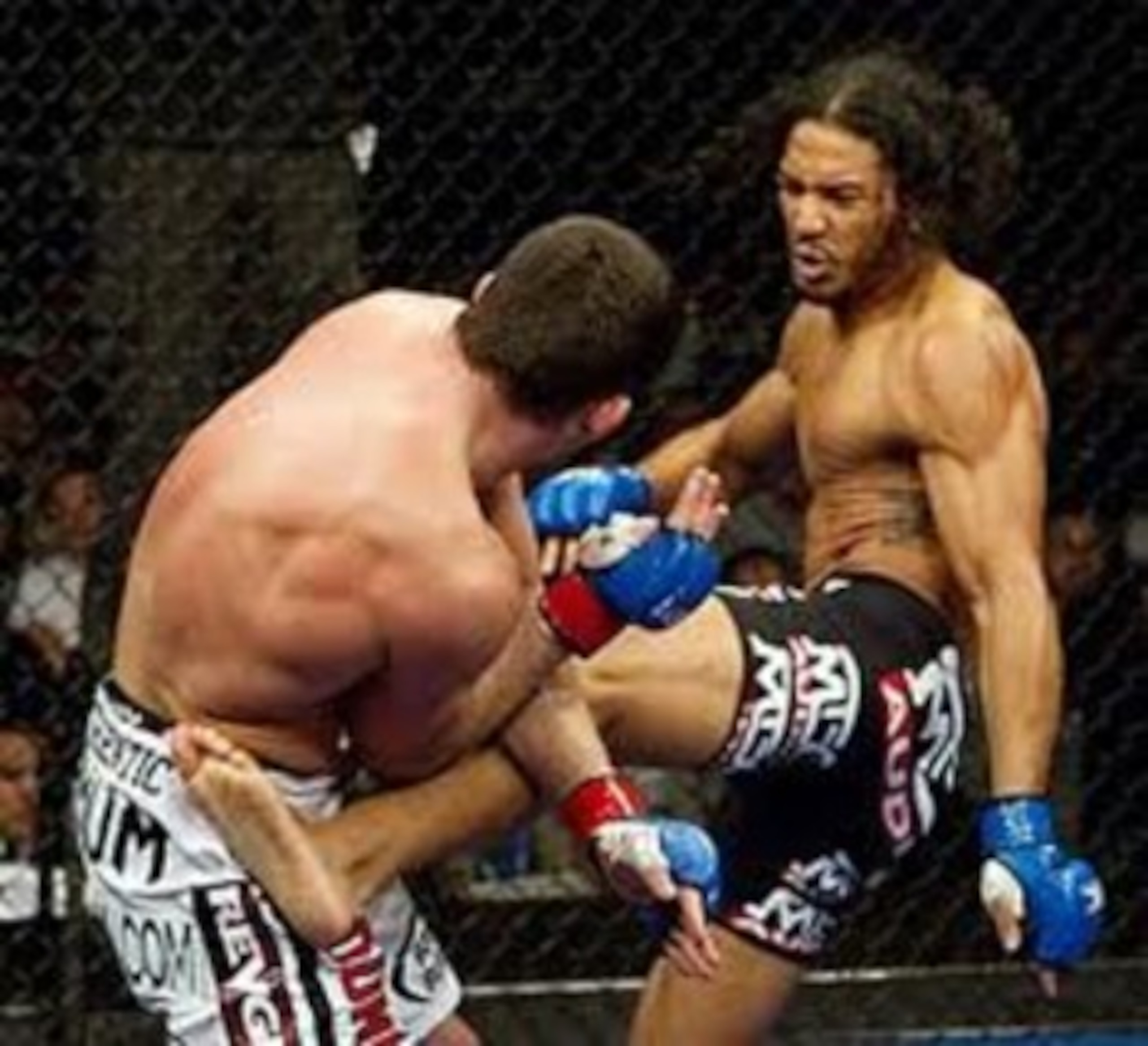 Ben Henderson delivering a vicious body kick