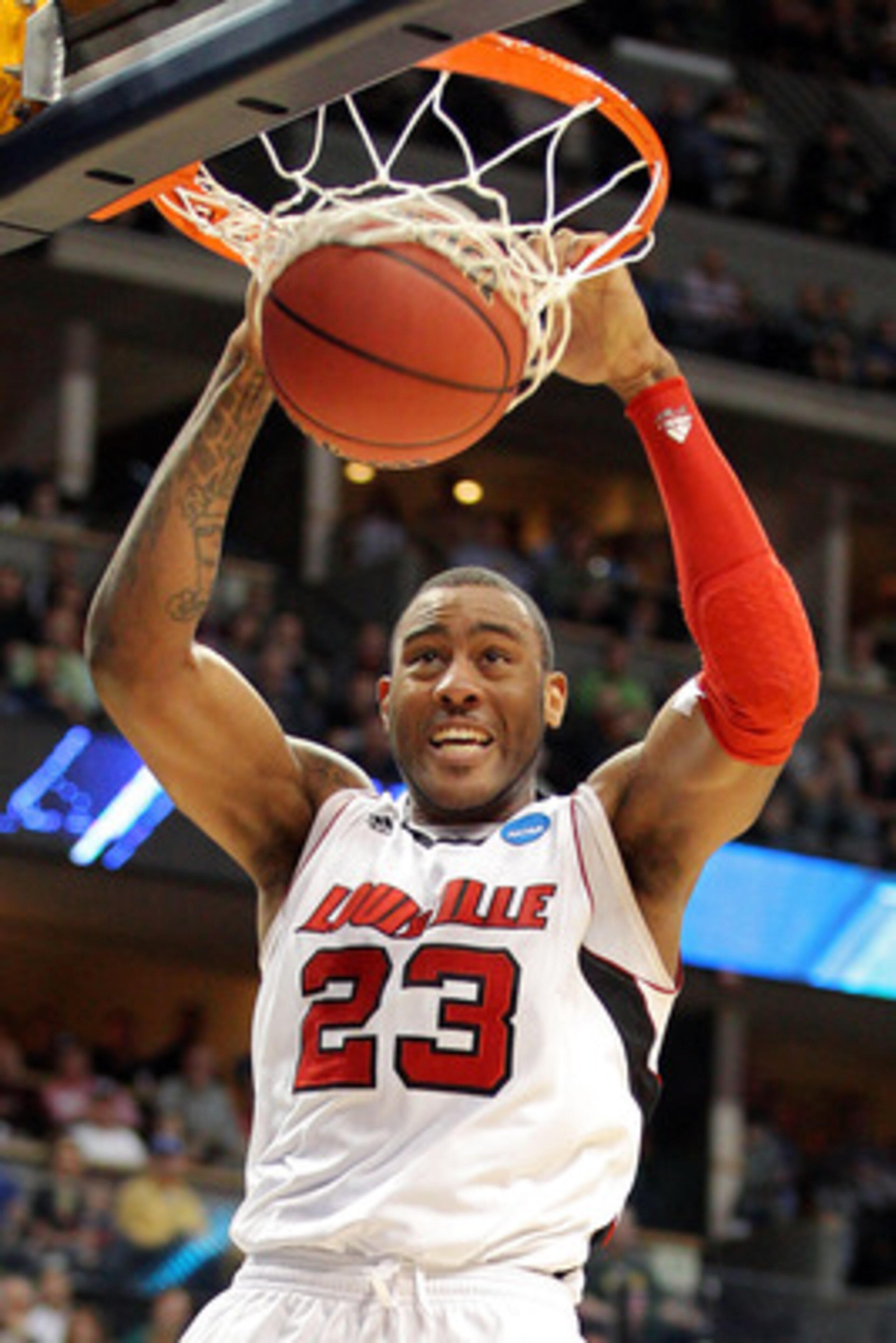 DENVER, CO - MARCH 17:  Terrence Jennings #23 of the Louisville Cardinals dunks the ball late in the against the Morehead State Eagles during the second round of the 2011 NCAA men's basketball tournament at Pepsi Center on March 17, 2011 in Denver, Colora