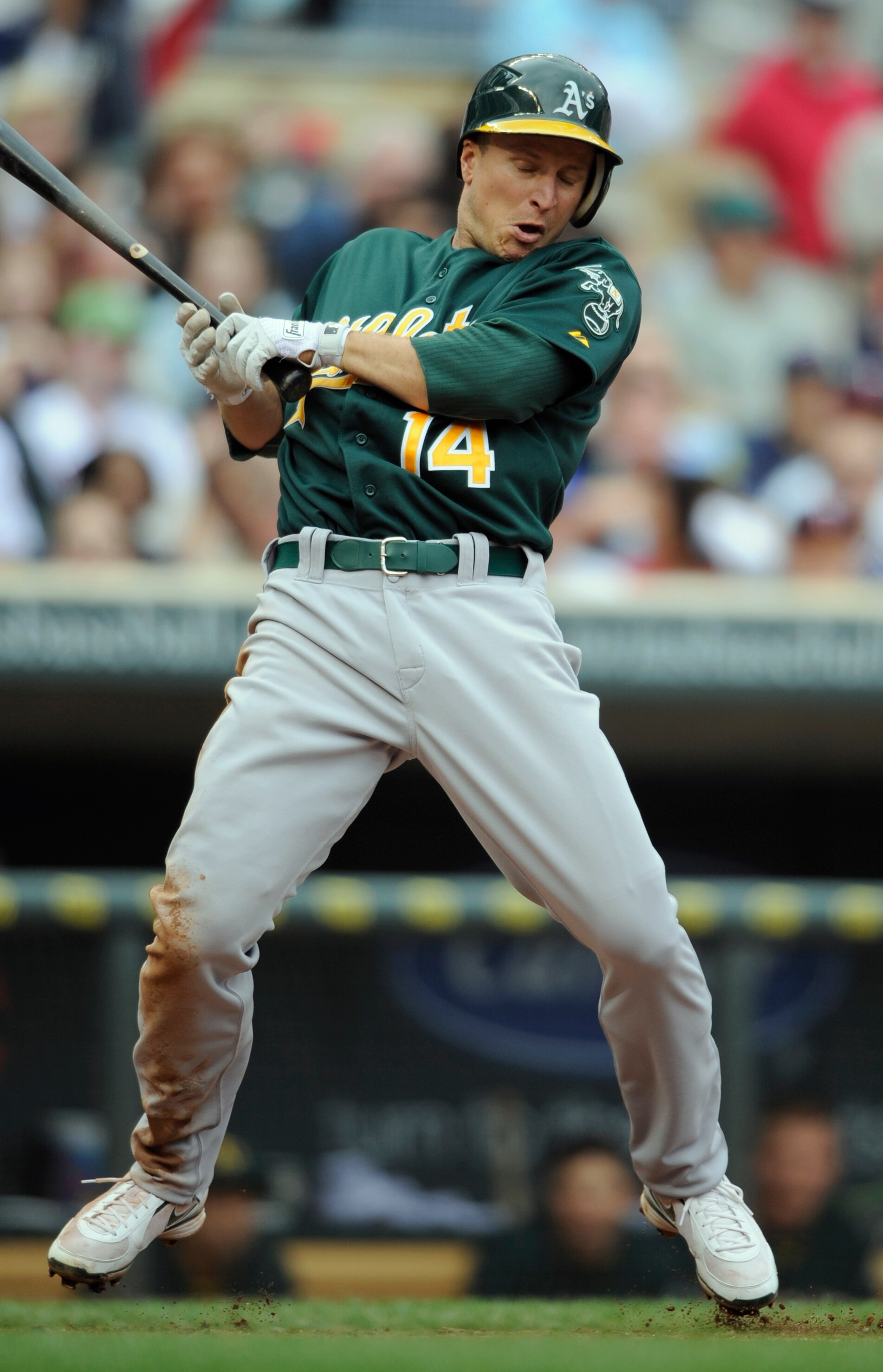 MINNEAPOLIS, MN - APRIL 10: Mark Ellis #14 of the Oakland Athletics jumps out of the way of a ball thrown by relief pitcher Alex Burnett #31 of the Minnesota Twins during the eighth inning of their game on April 10, 2011 at Target Field in Minneapolis, Mi
