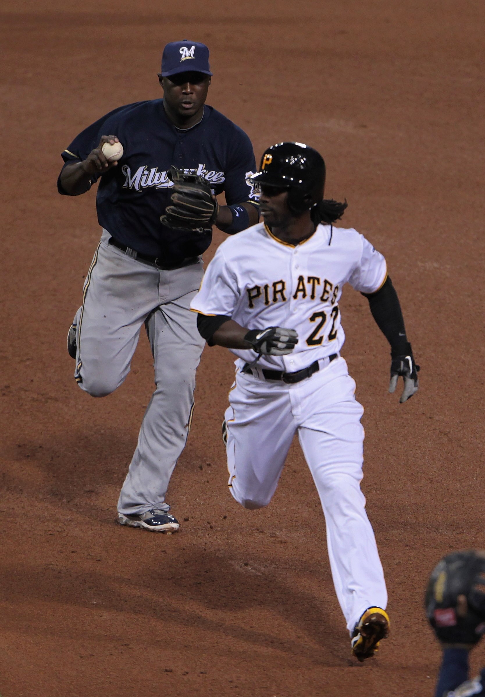 PITTSBURGH, PA - APRIL 14:  Andrew McCutchen #22 of the Pittsburgh Pirates gets caught in a run-down by Yuniesky Betancourt #3 of the Milwaukee Brewers at PNC Park on April 14, 2011 in Pittsburgh, Pennsylvania.  (Photo by Scott Halleran/Getty Images)