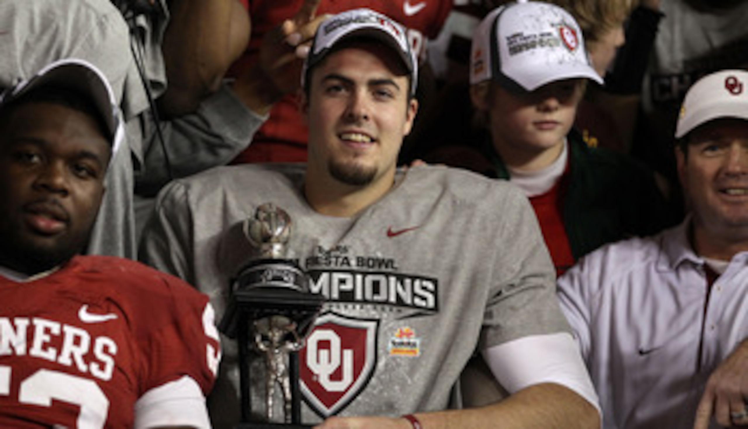 GLENDALE, AZ - JANUARY 01:  Quarterback Landry Jones #12 of the Oklahoma Sooners and offensive MVP celebrates the Sooners 48-20 victory against the Connecticut Huskies during the Tostitos Fiesta Bowl at the Universtity of Phoenix Stadium on January 1, 201
