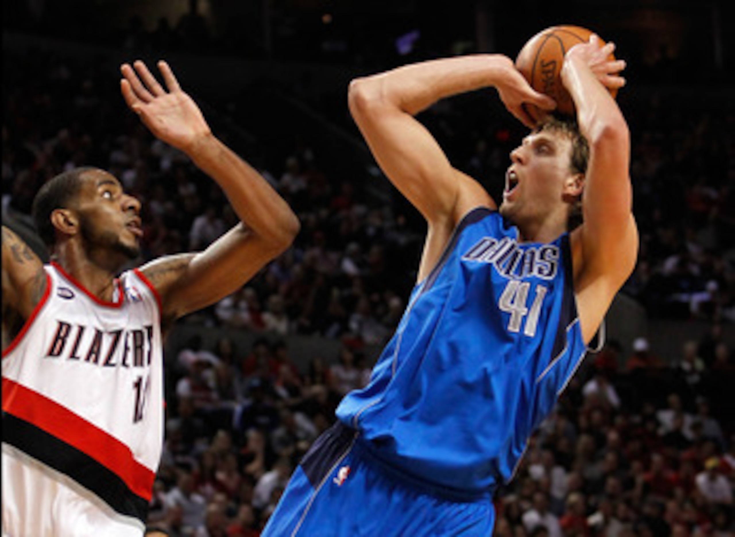 PORTLAND, OR - APRIL 23:  LaMarcus Aldrdige #12 of the Portland Trail Blazers defends Dirk Nowitzki #41 of the Dallas Mavericks in Game Four of the Western Conference Quarterfinals in the 2011 NBA Playoffs on April 23, 2011 at the Rose Garden in Portland,