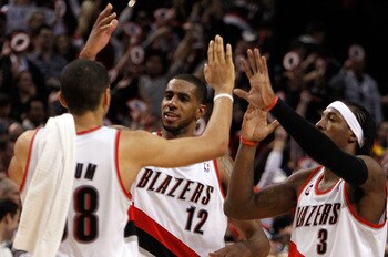 PORTLAND, OR - APRIL 21:  LaMarcus Aldridge #12, Gerald Wallace #3 and Nicolas Batum of the Portland Trail Blazers celebrates their 97-92 victory over the Dallas Mavericks in Game Three of the Western Conference Quarterfinals in the 2011 NBA Playoffs on A