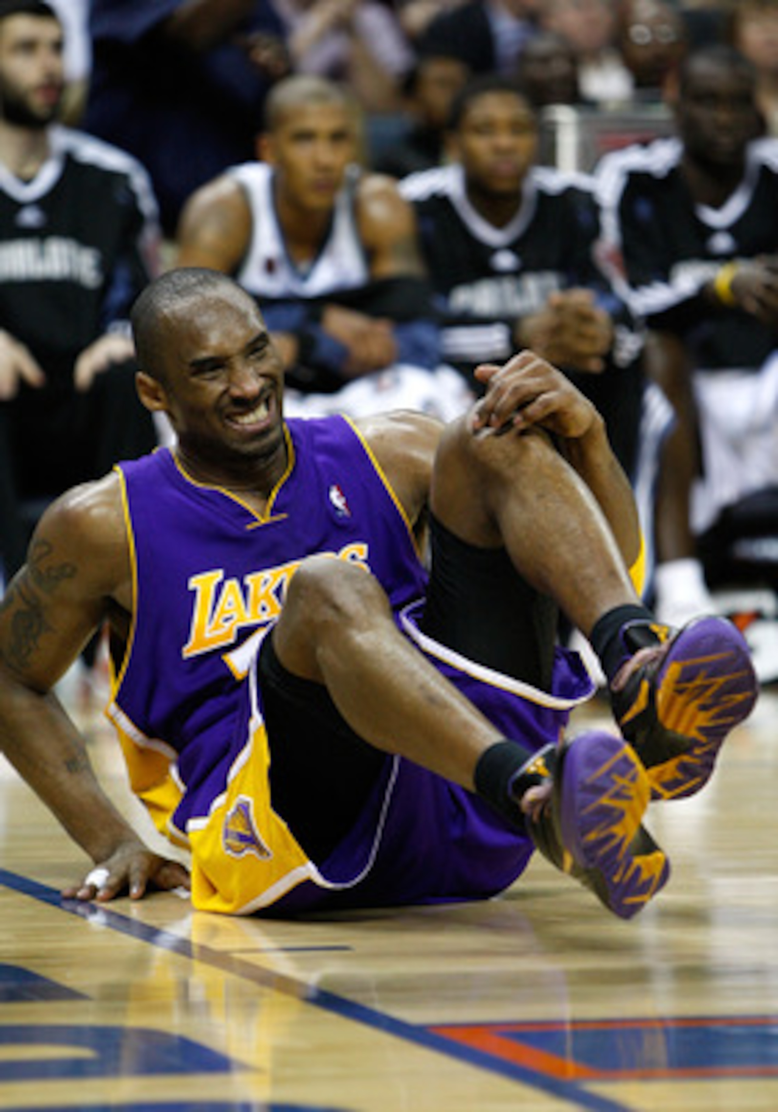 CHARLOTTE, NC - MARCH 31:  Kobe Bryant #24 of the Los Angeles Lakers winces in pain after landing on his ankle wrong against the Charlotte Bobcats during their game at Time Warner Cable Arena on March 31, 2009 in Charlotte, North Carolina.  NOTE TO USER: