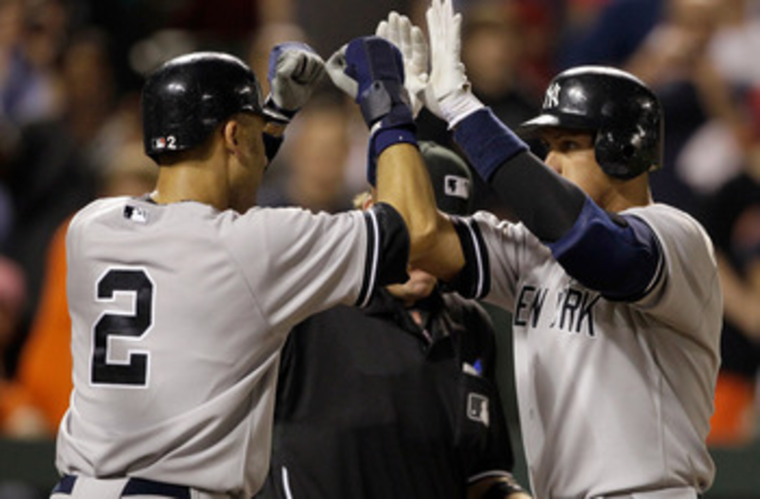 BALTIMORE, MD - APRIL 23:  Derek Jeter #2 congratulates Alex Rodriguez #13 of the New York Yankees after Rodriguez hit a grand slam home run against the Baltimore Orioles during the eighth inning at Oriole Park at Camden Yards on April 23, 2011 in Baltimo