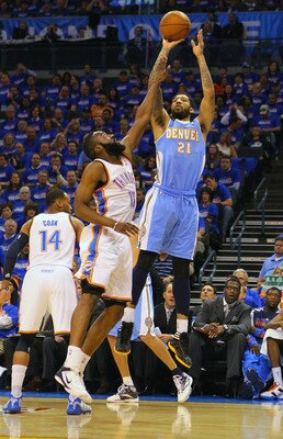 OKLAHOMA CITY, OK - APRIL 20: Wilson Chandler #21 of the Denver Nuggets shoots a basket over James Harden #13 of the Oklahoma City Thunder in Game Two of the Western Conference Quarterfinals in the 2011 NBA Playoffs on April 20, 2011 at the Ford Center in