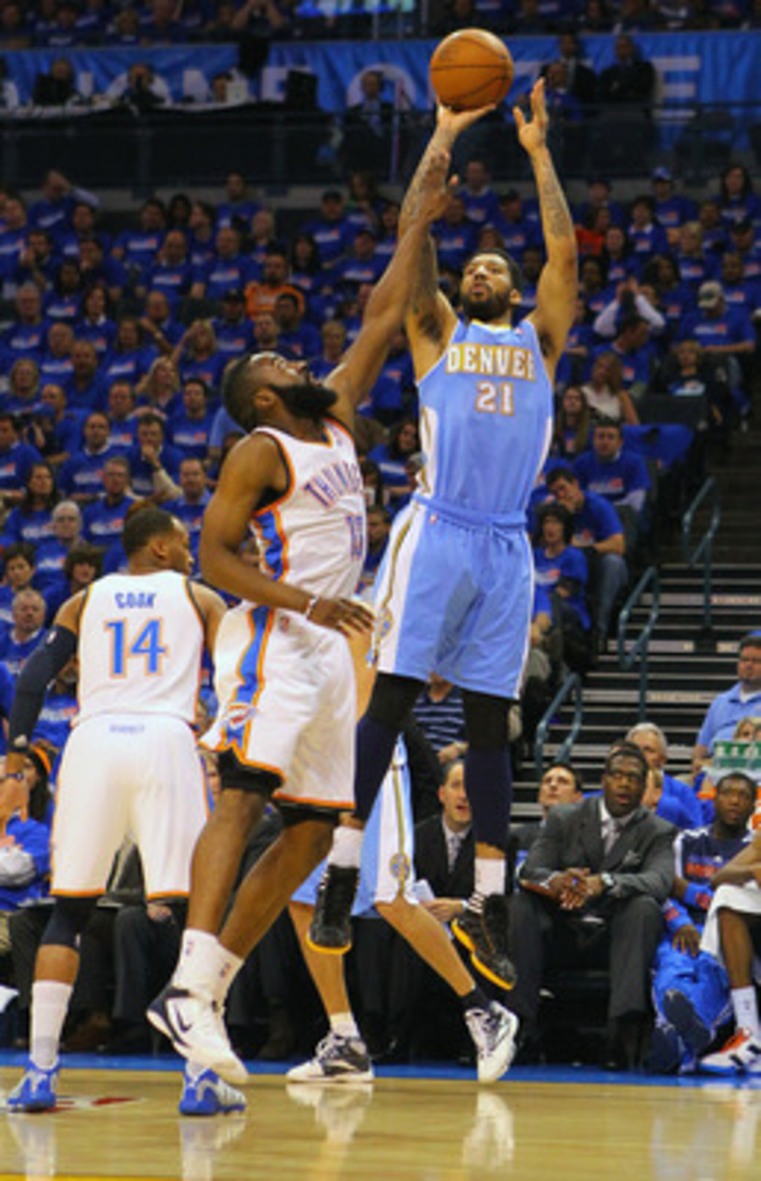 OKLAHOMA CITY, OK - APRIL 20: Wilson Chandler #21 of the Denver Nuggets shoots a basket over James Harden #13 of the Oklahoma City Thunder in Game Two of the Western Conference Quarterfinals in the 2011 NBA Playoffs on April 20, 2011 at the Ford Center in