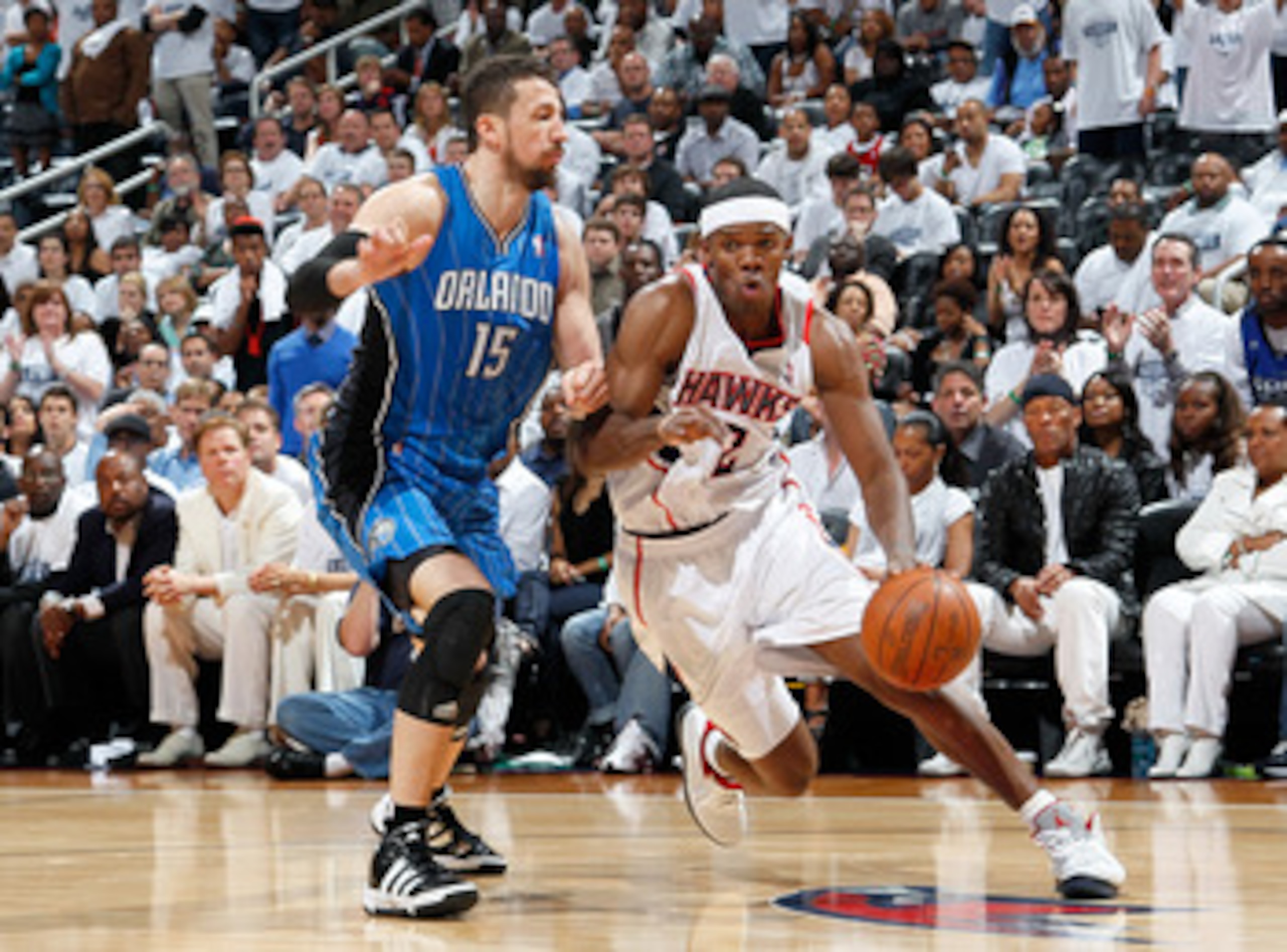 ATLANTA, GA - APRIL 22:  Joe Johnson #2 of the Atlanta Hawks against Hedo Turkoglu #15 of the Orlando Magic during Game Three of the Eastern Conference Quarterfinals in the 2011 NBA Playoffs at Philips Arena on April 22, 2011 in Atlanta, Georgia.  NOTE TO