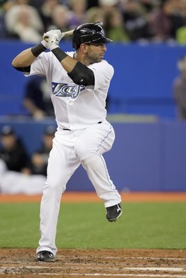 TORONTO - APRIL 12:  Jose Bautista #19 of the Toronto Blue Jays steps into the swing during the game against the Chicago White Sox at the Rogers Centre on April 12, 2010 in Toronto, Ontario. (Photo By Dave Sandford/Getty Images)