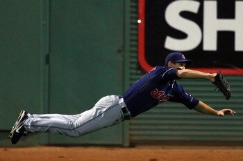 BOSTON - OCTOBER 20:  Grady Sizemore #24 of the Cleveland Indians dives to catch a ball hit by Jacoby Ellsbury #46 of the Boston Red Sox in the fourth inning of Game Six of the American League Championship Series at Fenway Park on October 20, 2007 in Bost