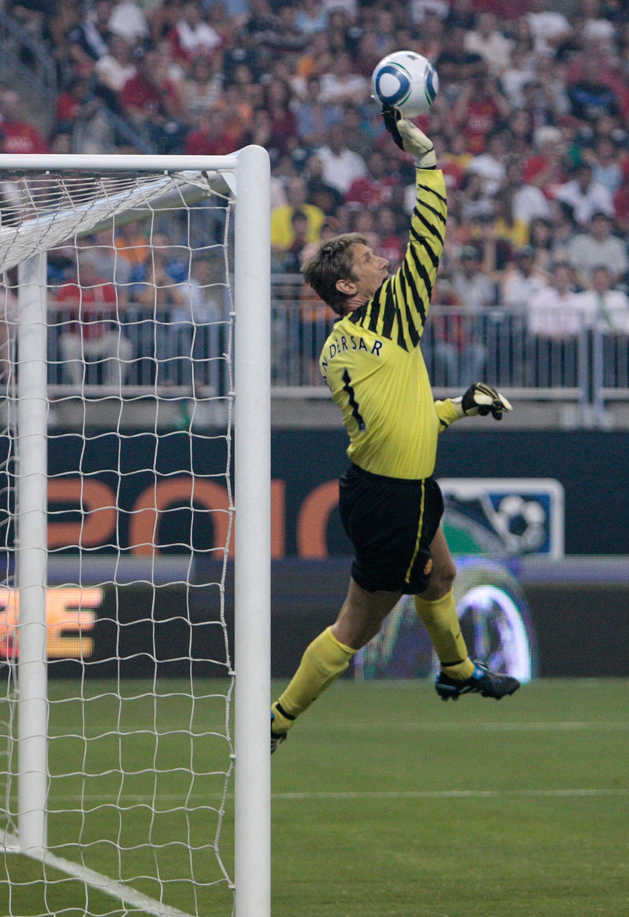 HOUSTON - JULY 28:  Edwin van der Sar #1 of Manchester United makes a save during the MLS All Star Game at Reliant Stadium on July 28, 2010 in Houston, Texas.  (Photo by Bob Levey/Getty Images)