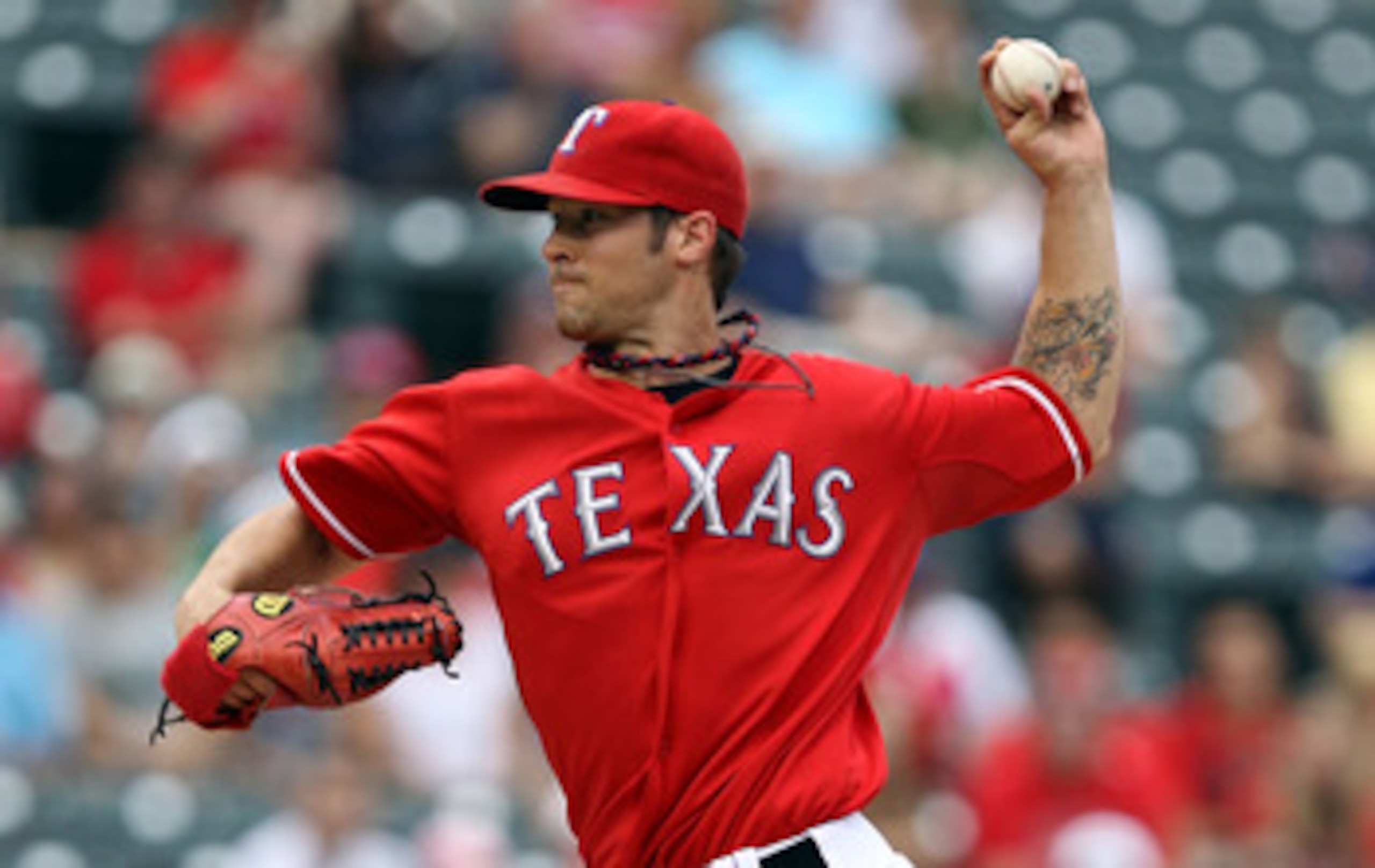 ARLINGTON, TX - APRIL 24:  Pitcher C.J. Wilson #36 of the Texas Rangers throws against the Kansas City Royals at Rangers Ballpark in Arlington on April 24, 2011 in Arlington, Texas.  (Photo by Ronald Martinez/Getty Images)