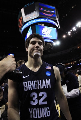 NEW ORLEANS, LA - MARCH 24:  Jimmer Fredette #32 of the Brigham Young Cougars walks off of the court rejected after their 74 to 83 loss to the Florida Gators in the Southeast regional of the 2011 NCAA men's basketball tournament at New Orleans Arena on Ma