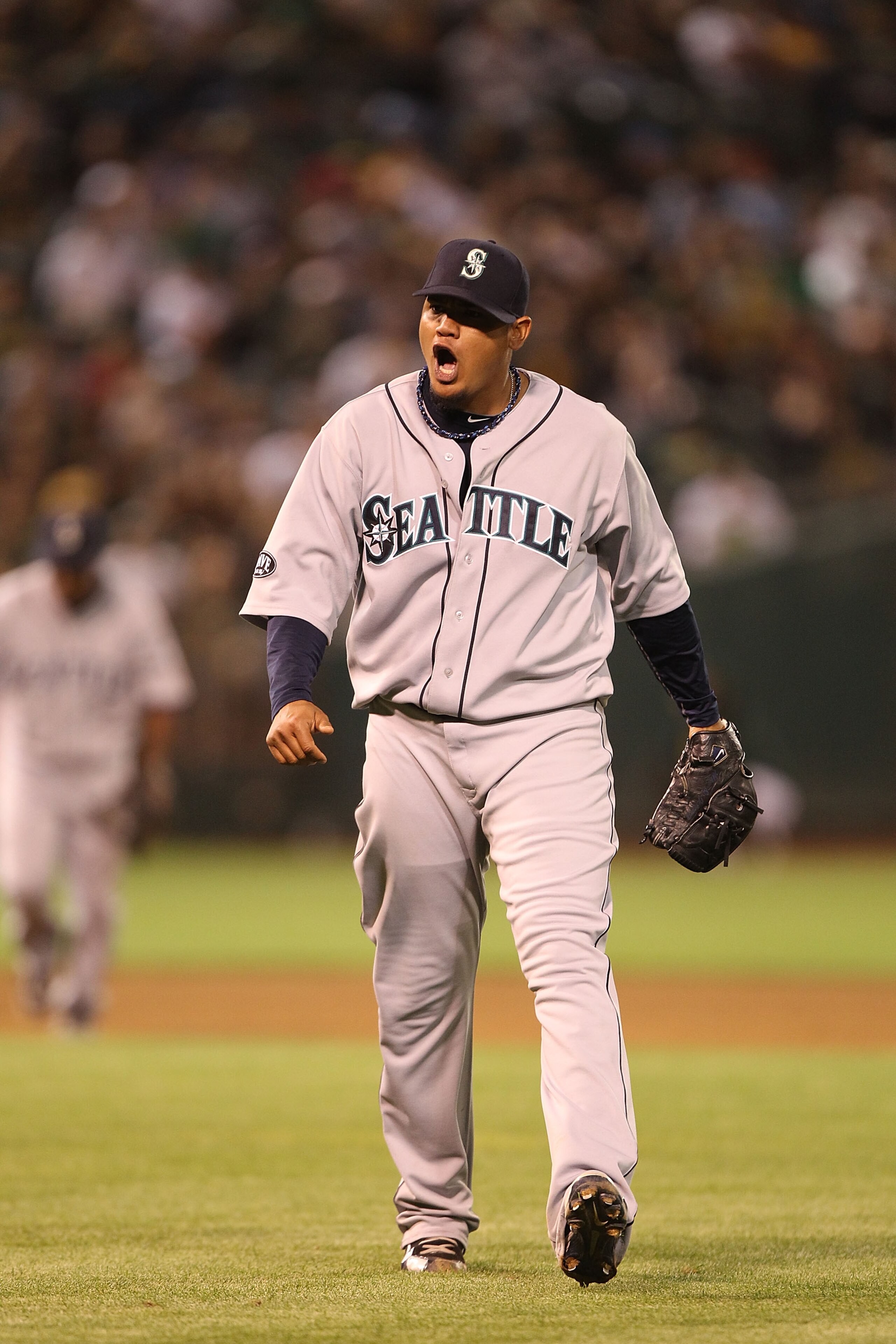 OAKLAND, CA - APRIL 01:  Felix Hernandez #34 of the Seattle Mariners celebrates at the end of the eighth inning against the Oakland Athletics during an opening day game of Major League Baseball at the Oakland-Alameda County Coliseum on April 1, 2011 in Oa