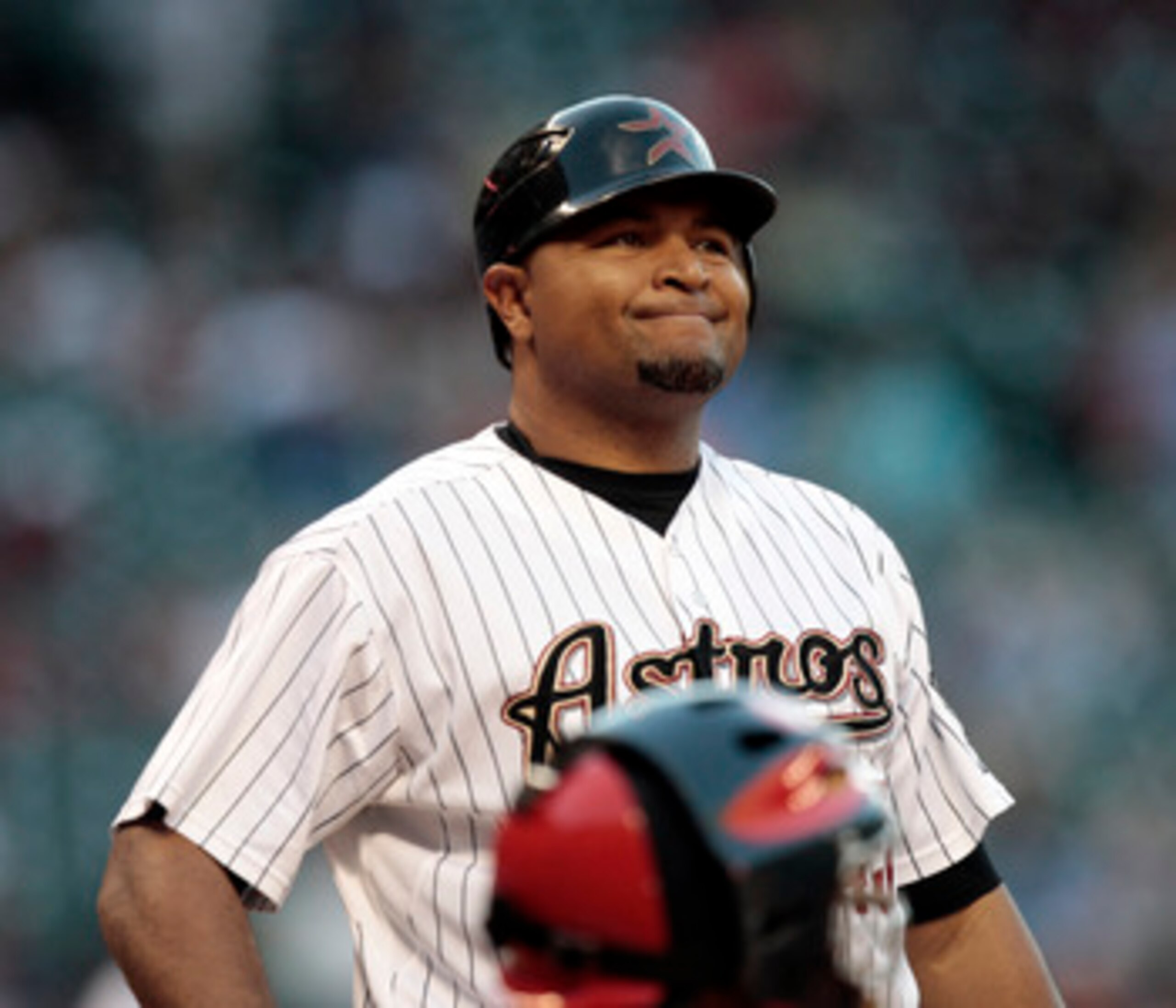 HOUSTON - APRIL 27:  Carlos Lee #45 of the Houston Astros reacts after a strike called against the St. Louis Cardinals at Minute Maid Park on April 27, 2011 in Houston, Texas.  (Photo by Bob Levey/Getty Images)