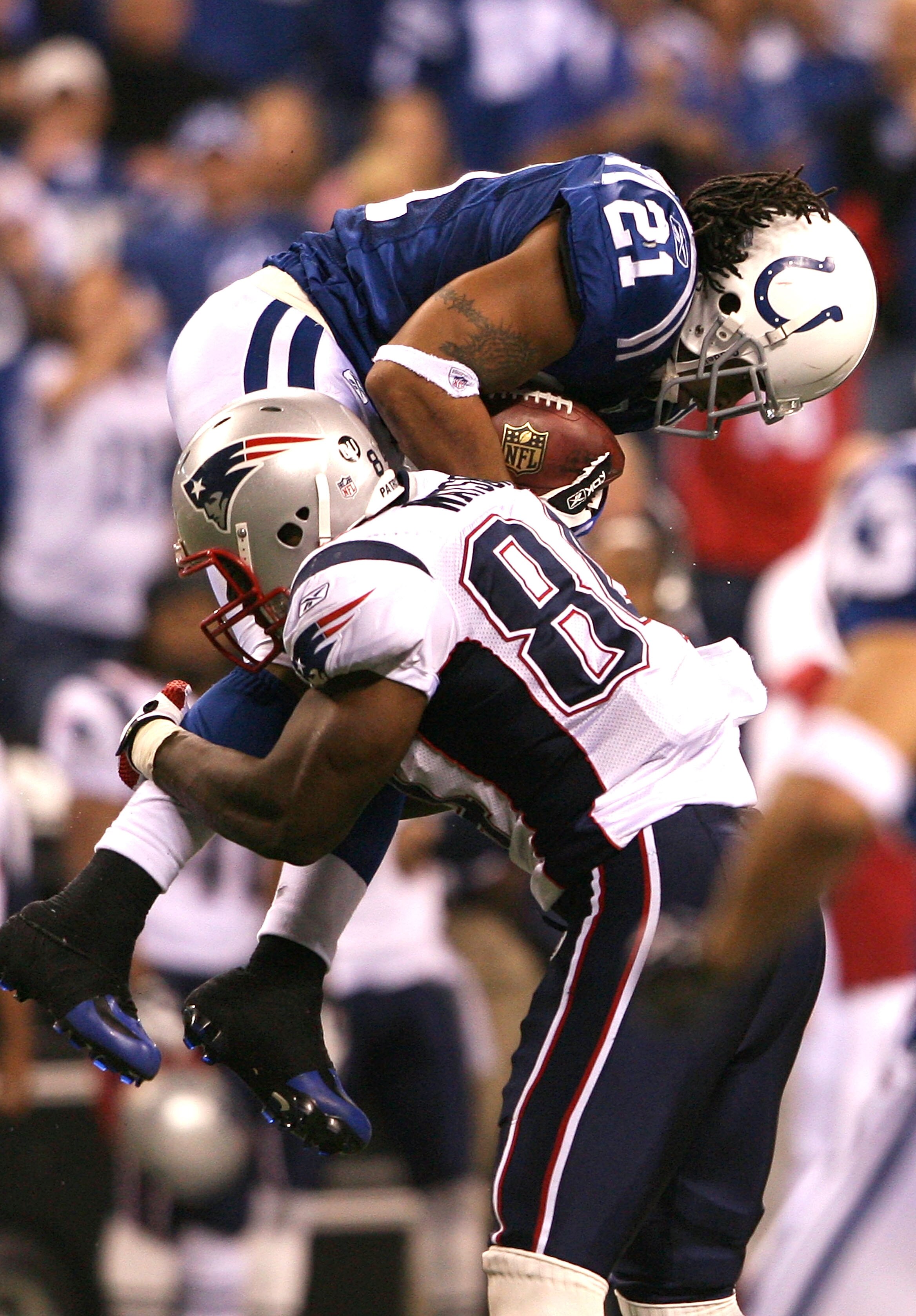 INDIANAPOLIS - NOVEMBER 02:  Bob Sanders #21 of the Indianapolis Colts intercepts a pass in the fourth quarter against Randy Moss #81 of the New England Patriots at Lucas Oil Stadium on November 2, 2008 in Indianapolis, Indiana.  (Photo by Andy Lyons/Gett
